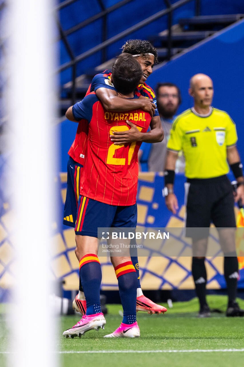 Lamine Yamal of Spain celebrates with Mikel Oyarzabal