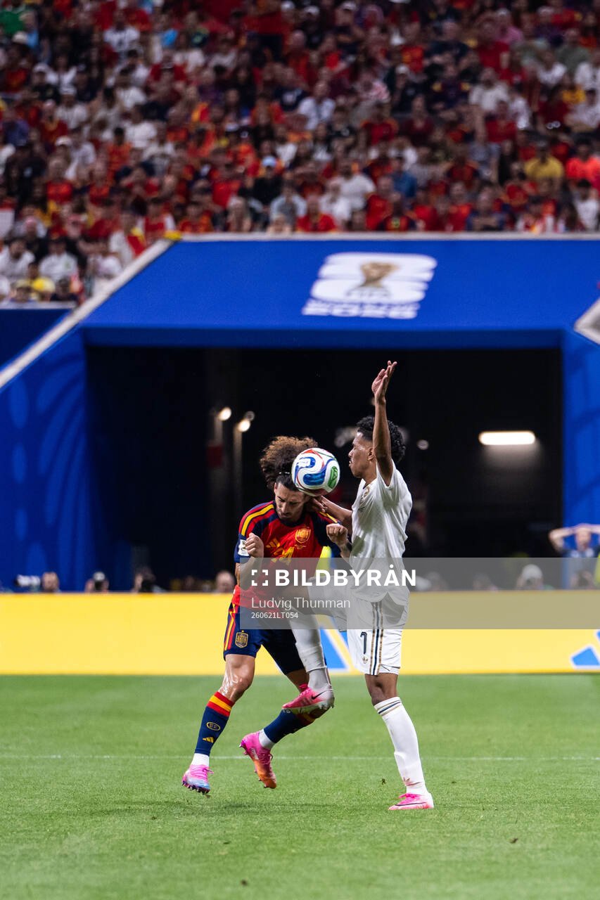 Marc Cucurella of Spain and Musab Aljuwayr of Saudi Arabia