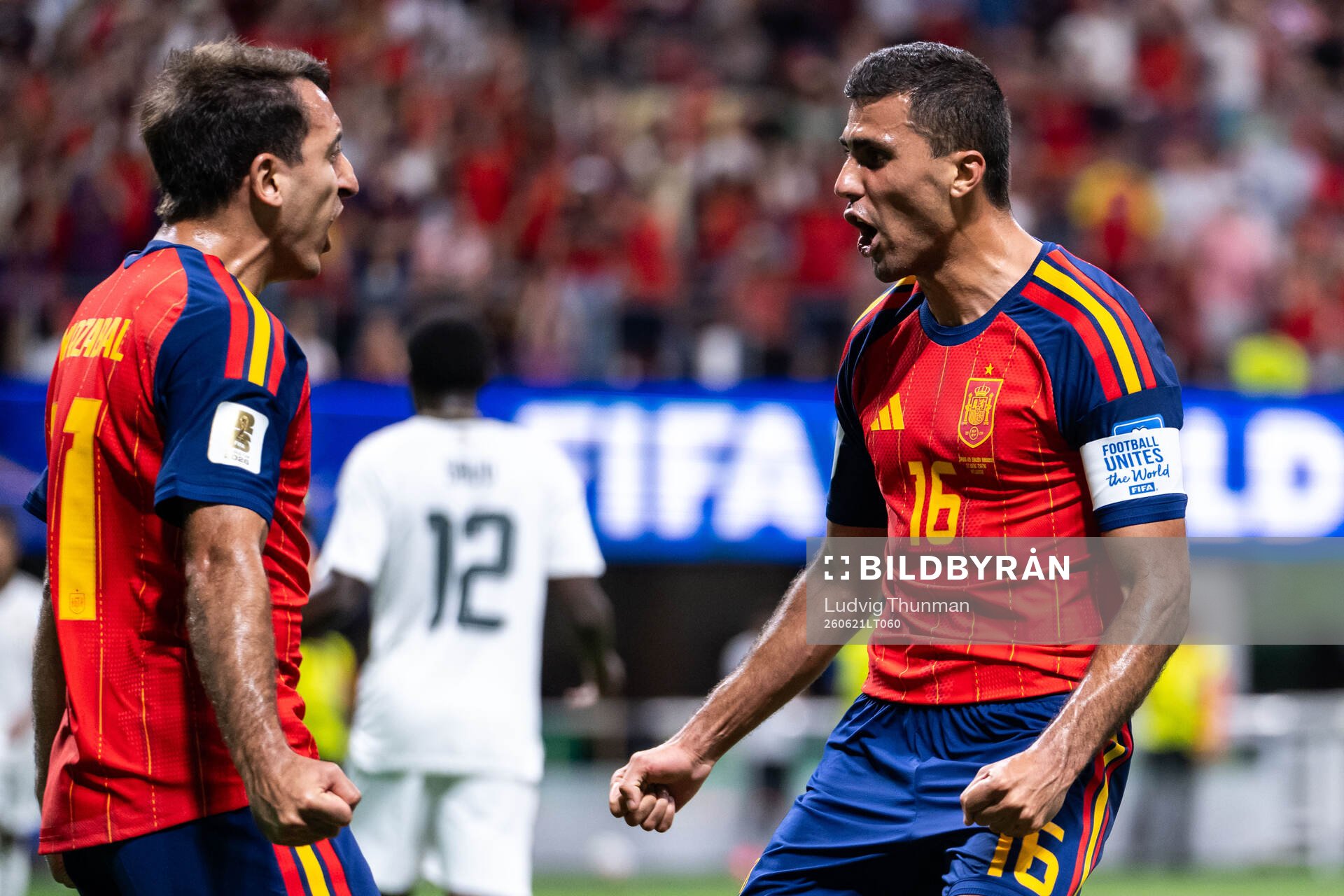Mikel Oyarzabal of Spain celebrates with Rodri