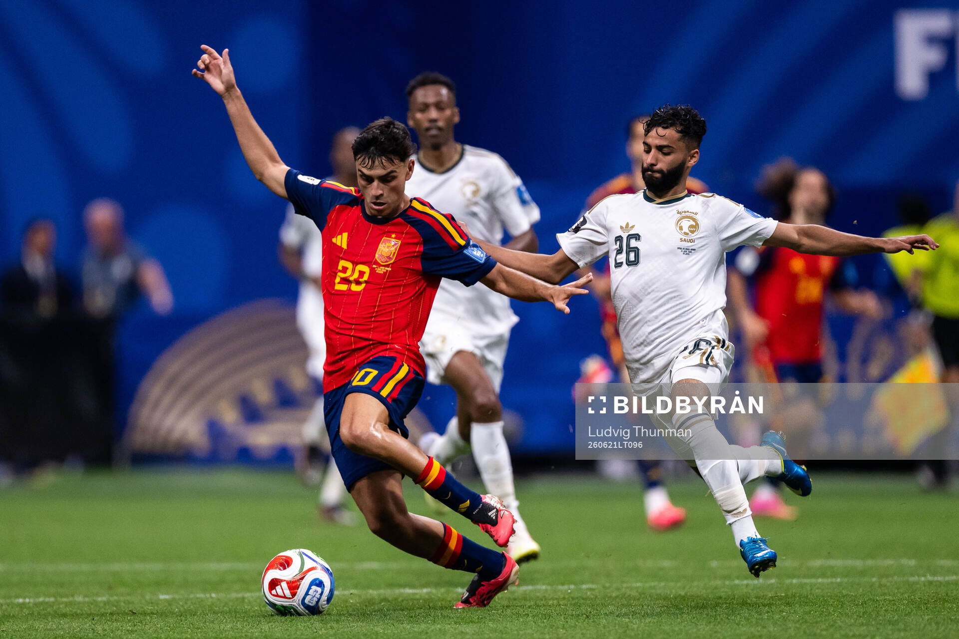 Pedri of Spain and Mohammed Abu Alshamat of Saudi Arabia