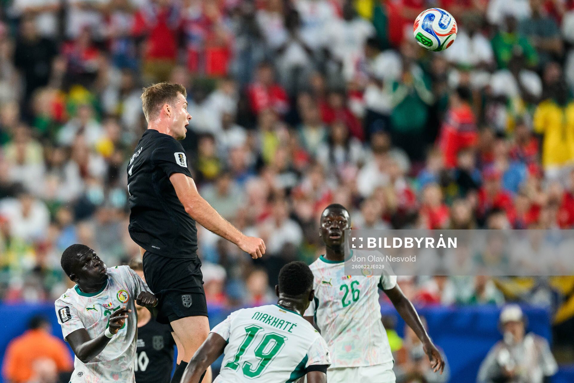 Alexander Sørloth of Norway and Pape Gueye of Senegal