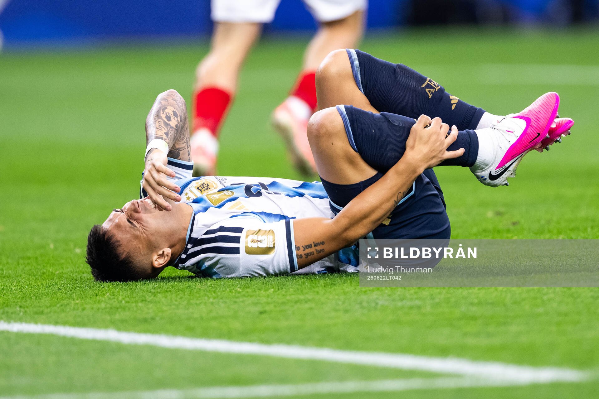Lautaro Martinez of Argentina in pain
