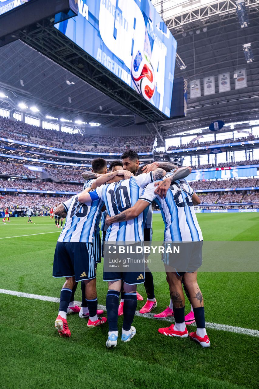 Lionel Messi of Argentina celebrates with Cristian Romero,