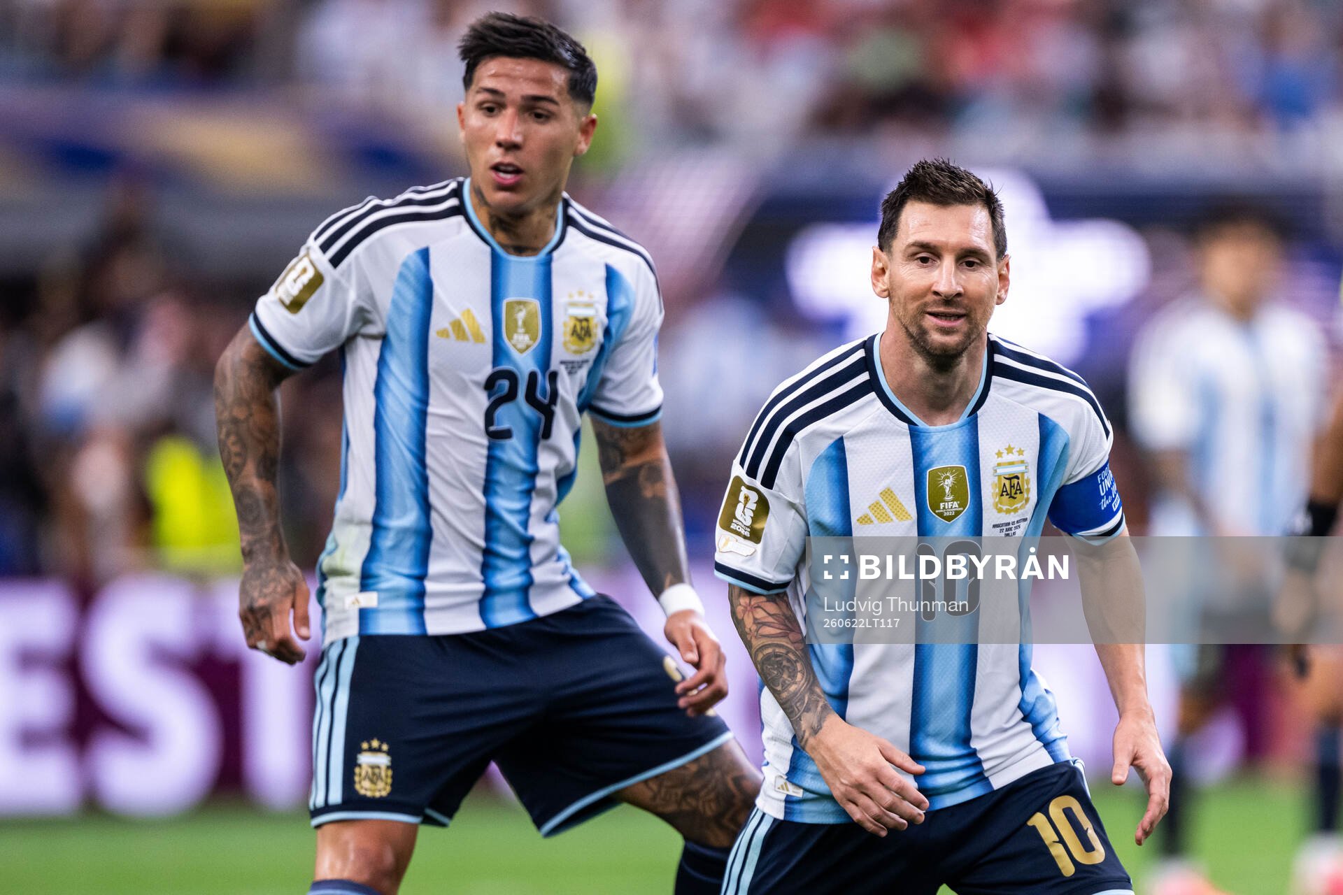 Enzo Fernandez and Lionel Messi of Argentina