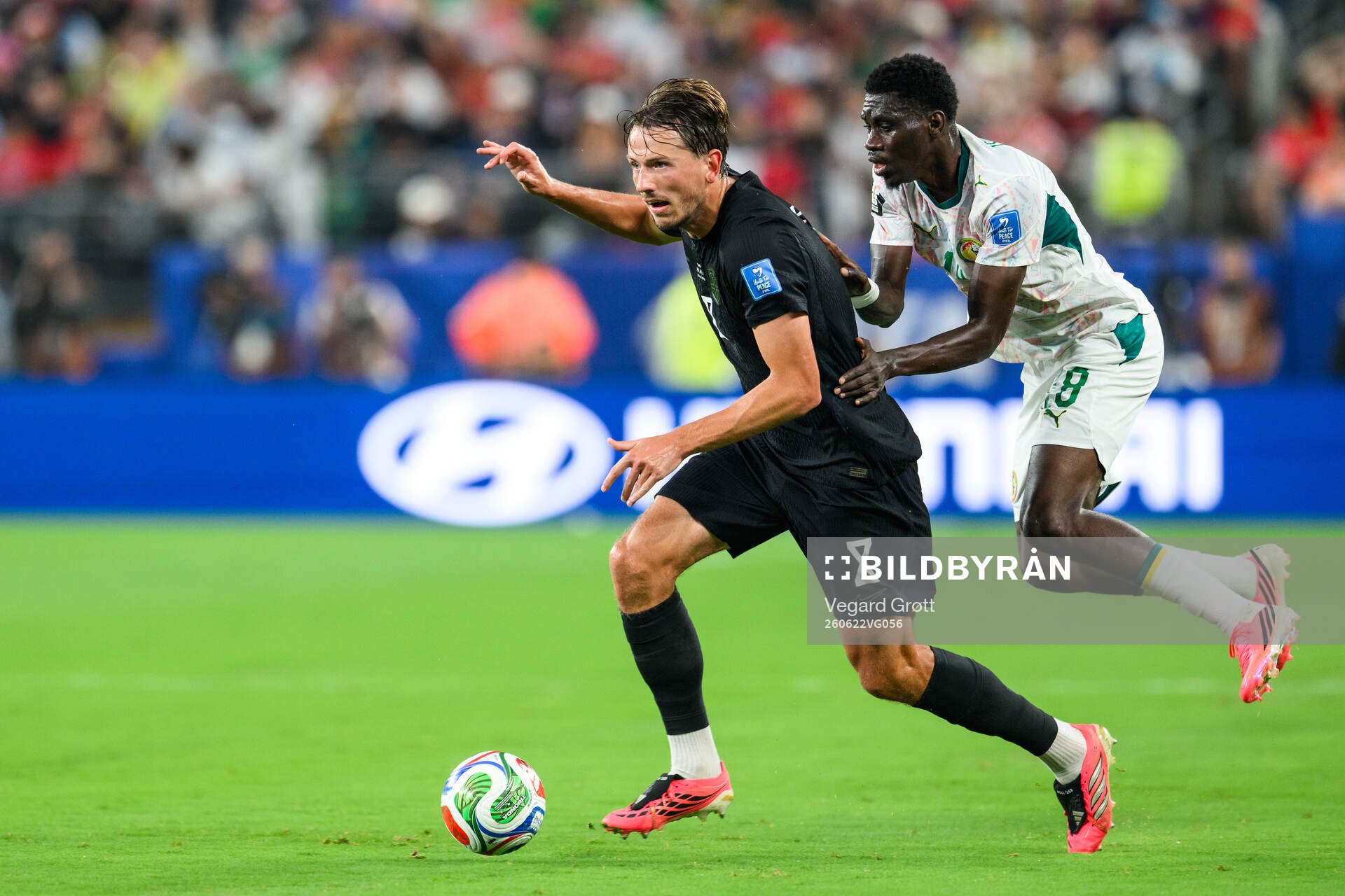 Sander Berge of Norway and Lamine Camara of Senegal