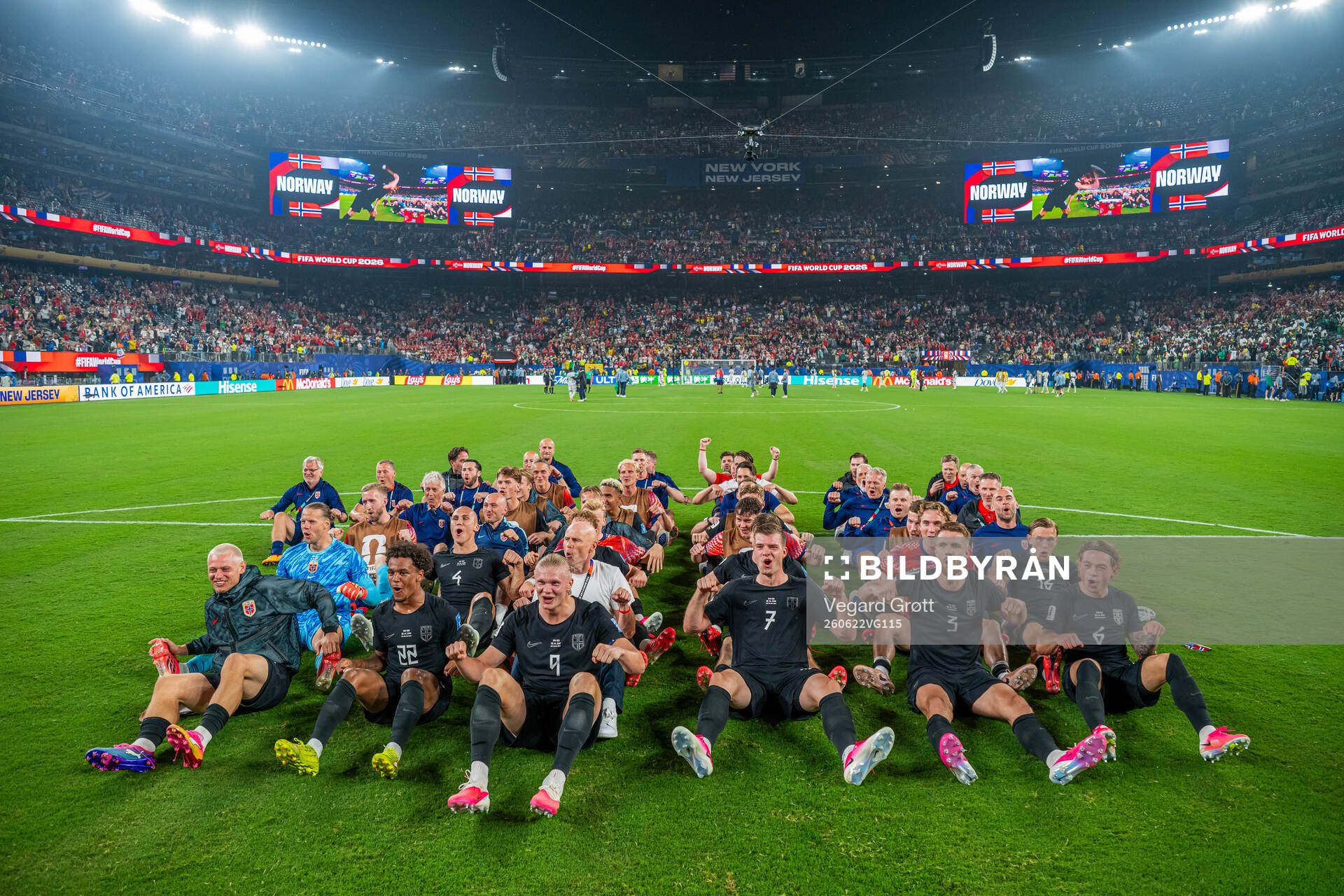 Players and staff of Norway celebrate with a viking row