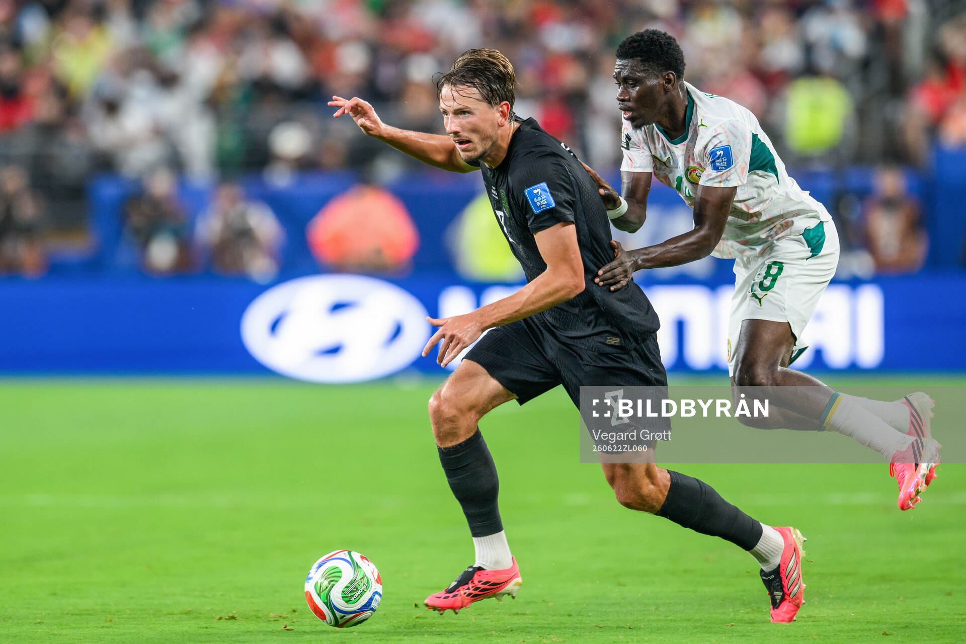 Sander Berge of Norway and Lamine Camara of Senegal