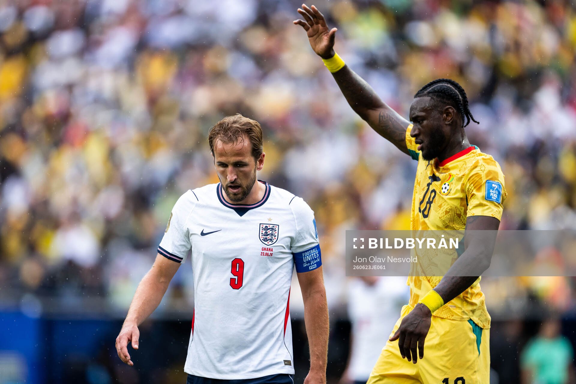 Harry Kane of England and Jerome Opoku of Ghana