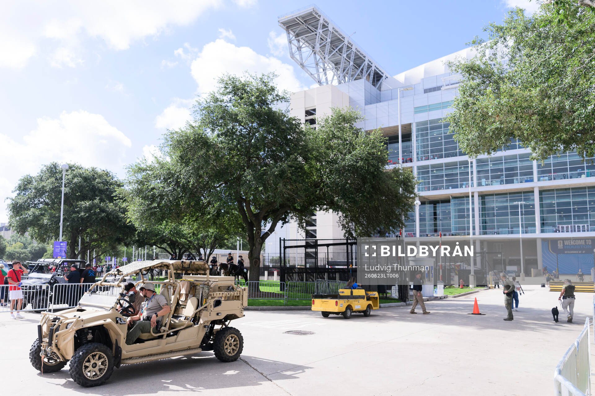 Security personel in a vehicle outside Houston Stadium