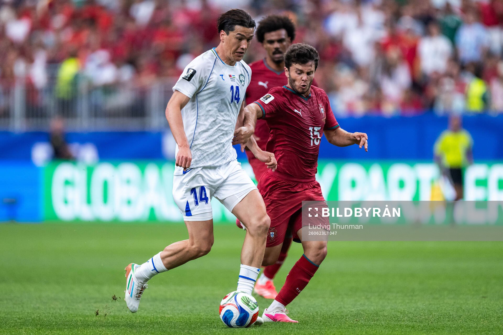Eldor Shomurodov of Uzbekistan and Joao Neves of Portugal