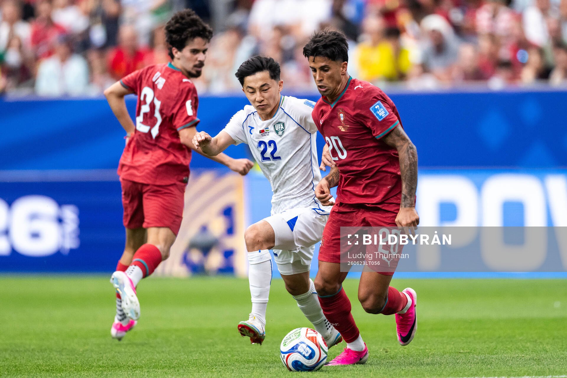 Abbosbek Fayzullaev of Uzbekistan and Joao Cancelo of