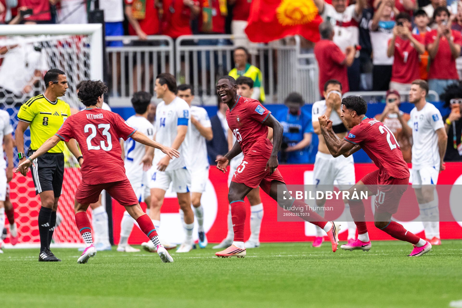 Nuno Mendes of Portugal celebrates with Vitinha and Joao