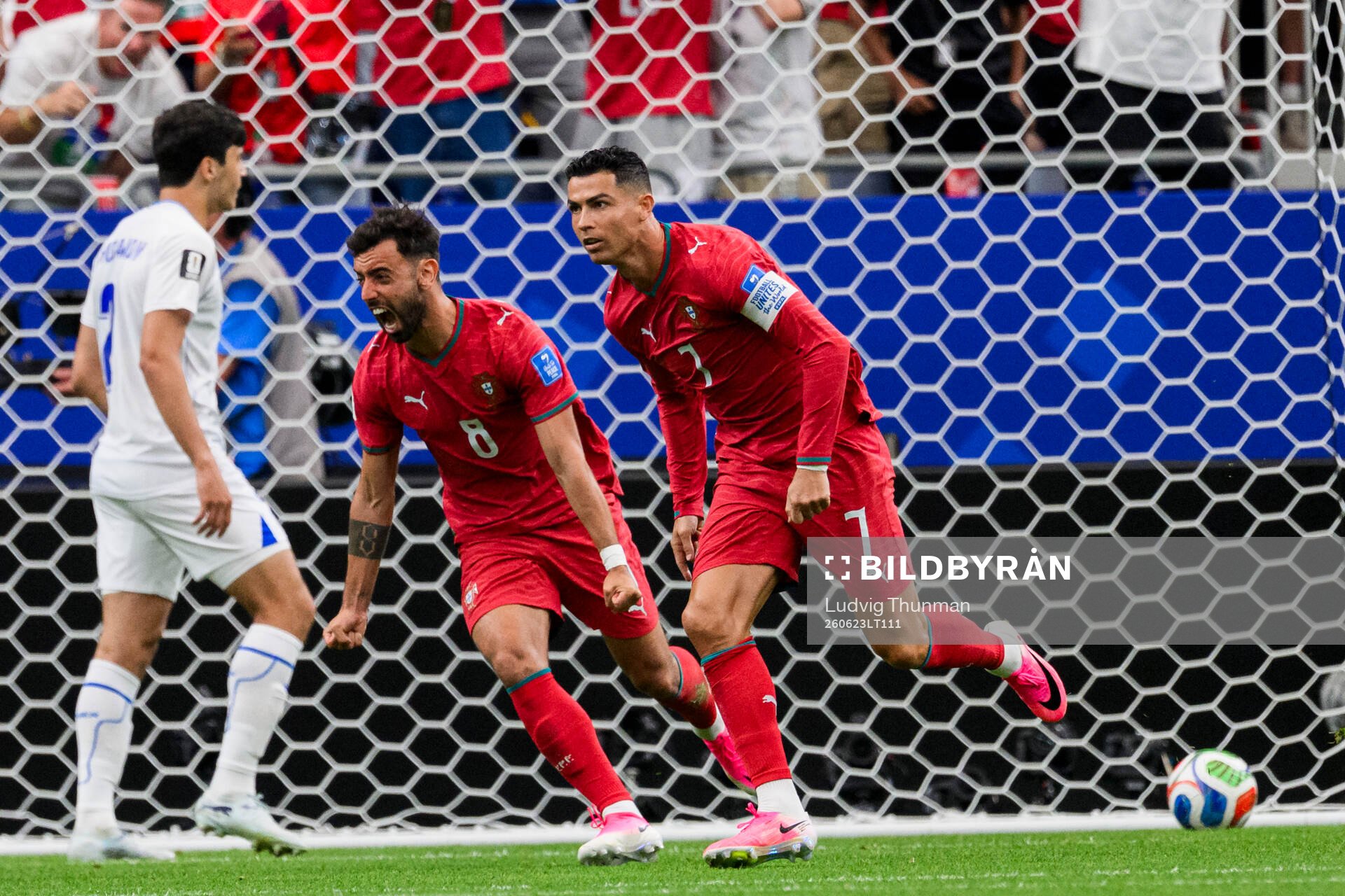 Bruno Fernandes and Cristiano Ronaldo of Portugal celebrate