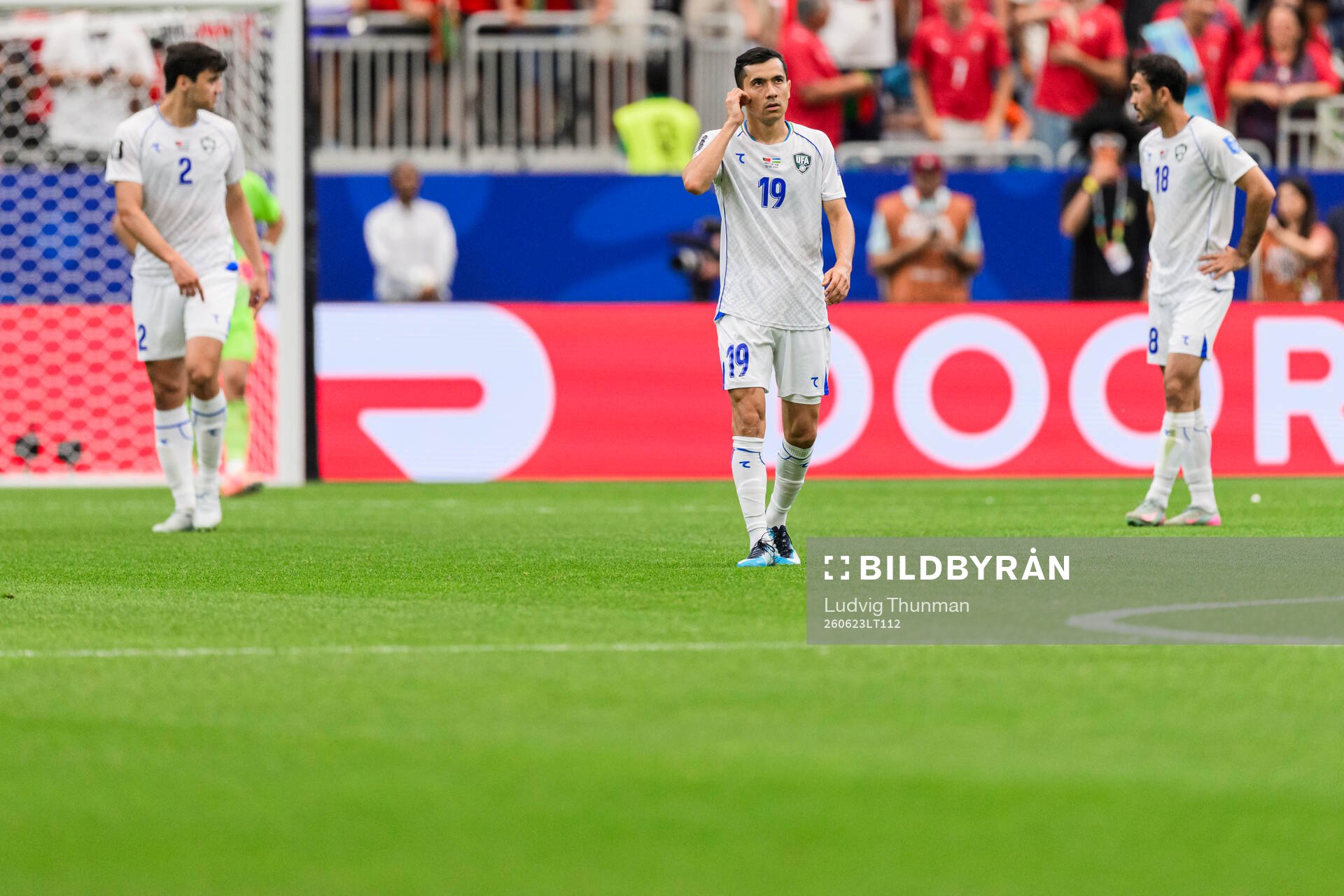 Azizjon Ganiev of Uzbekistan looks dejected