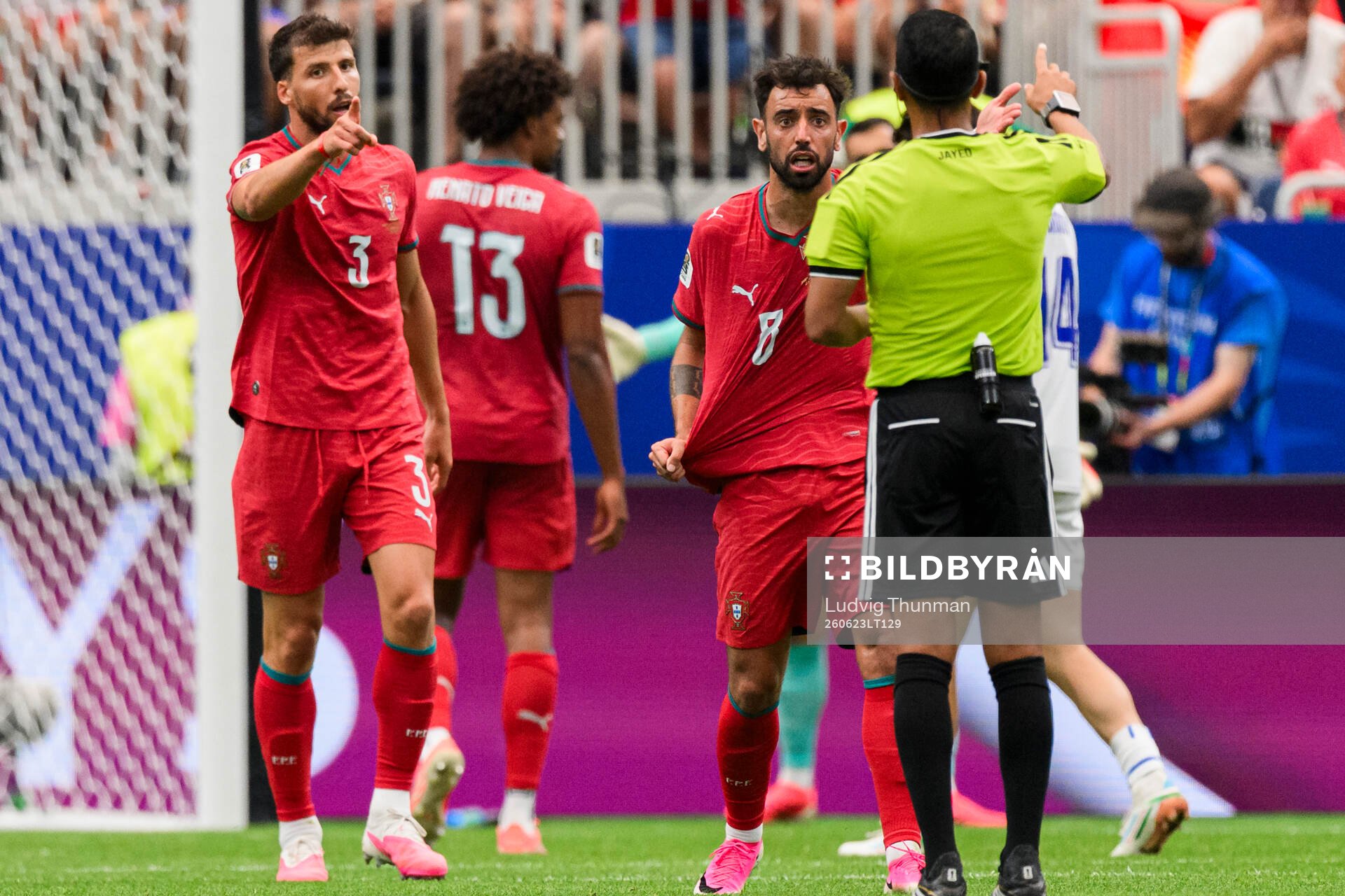 Ruben Dias and Bruno Fernandes of Portugal reacts against