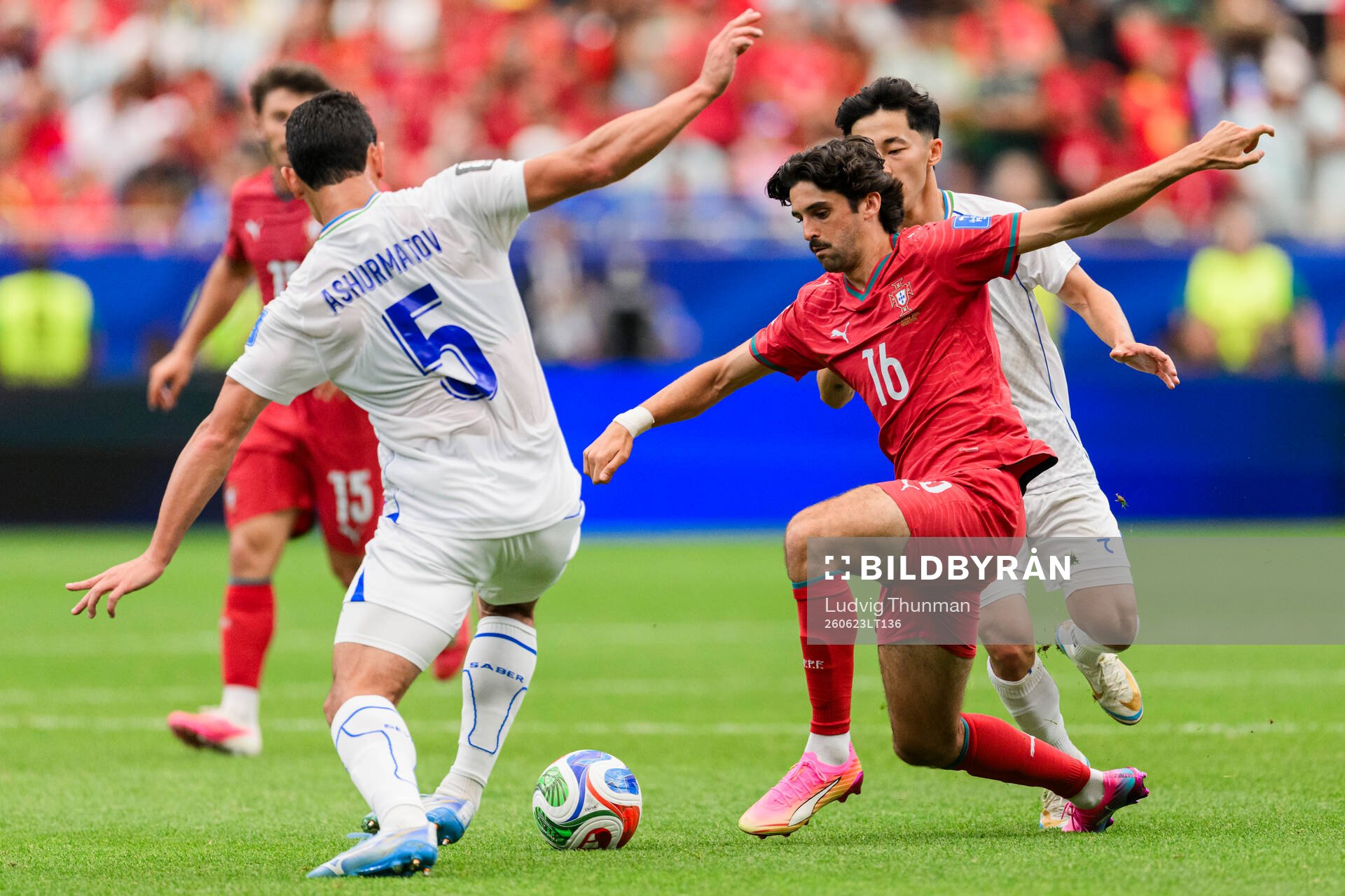 Rustam Ashurmatov of Uzbekistan and Francisco Trincao of