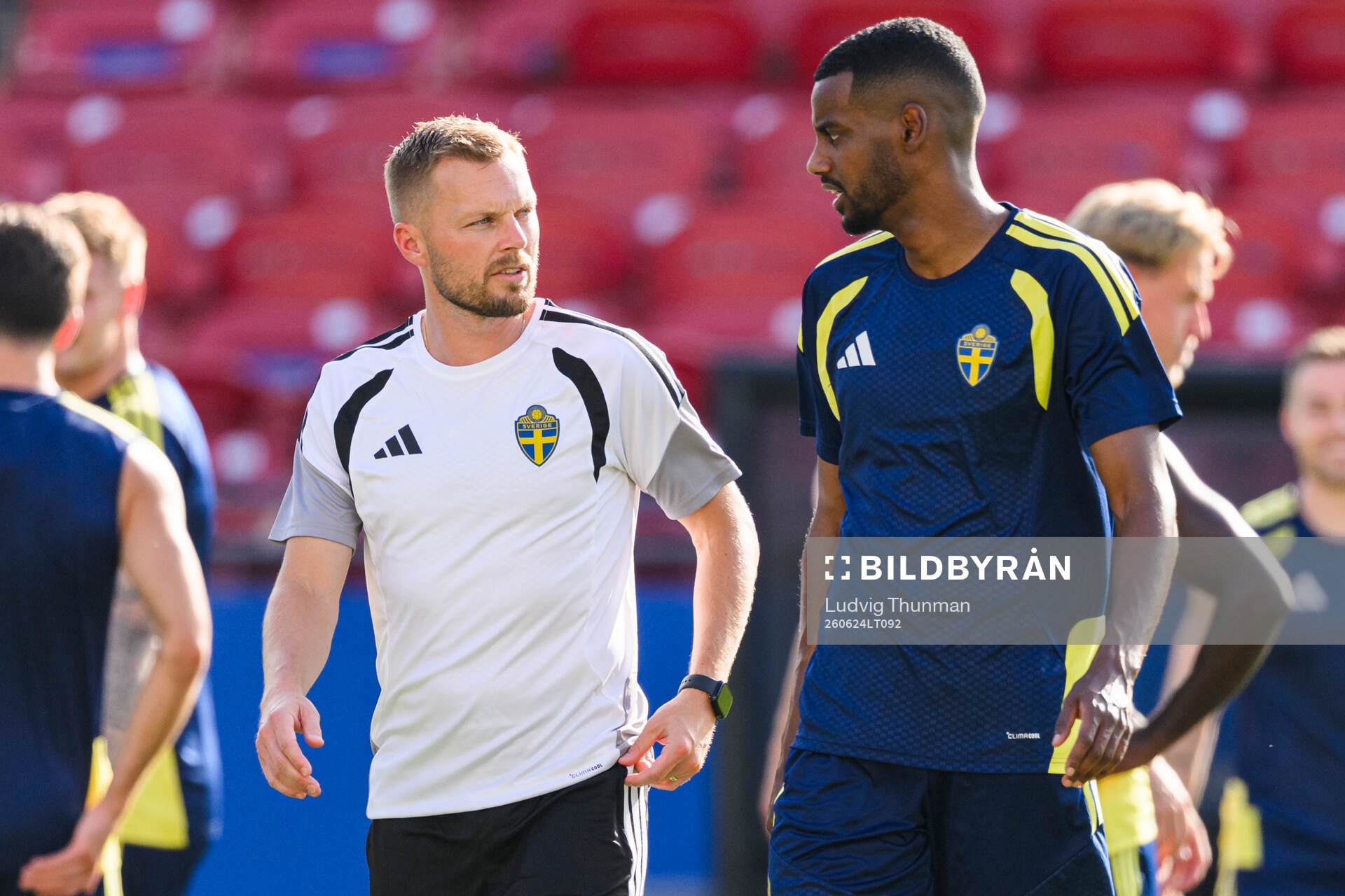 Assistant coach Sebastian Larsson and Alexander Isak of the