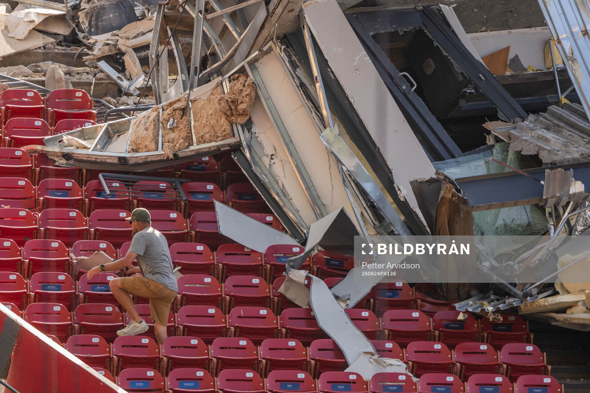 Stadium personnel in the stands bellow