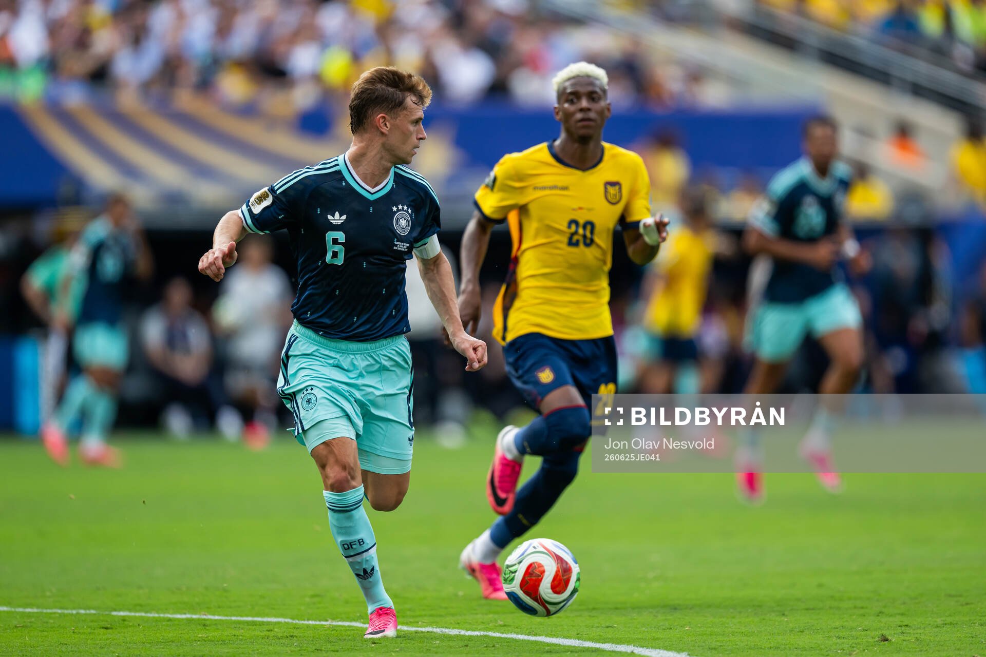 Joshua Kimmich of Germany and Nilson Angulo of Ecuador