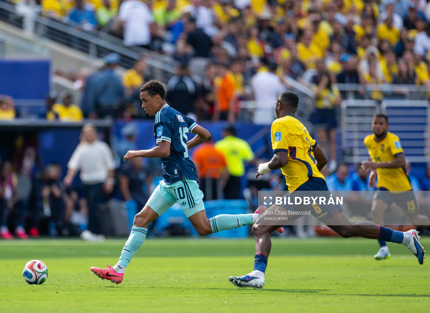Jamal Musiala of Germany and Willian Pacho of Ecuador