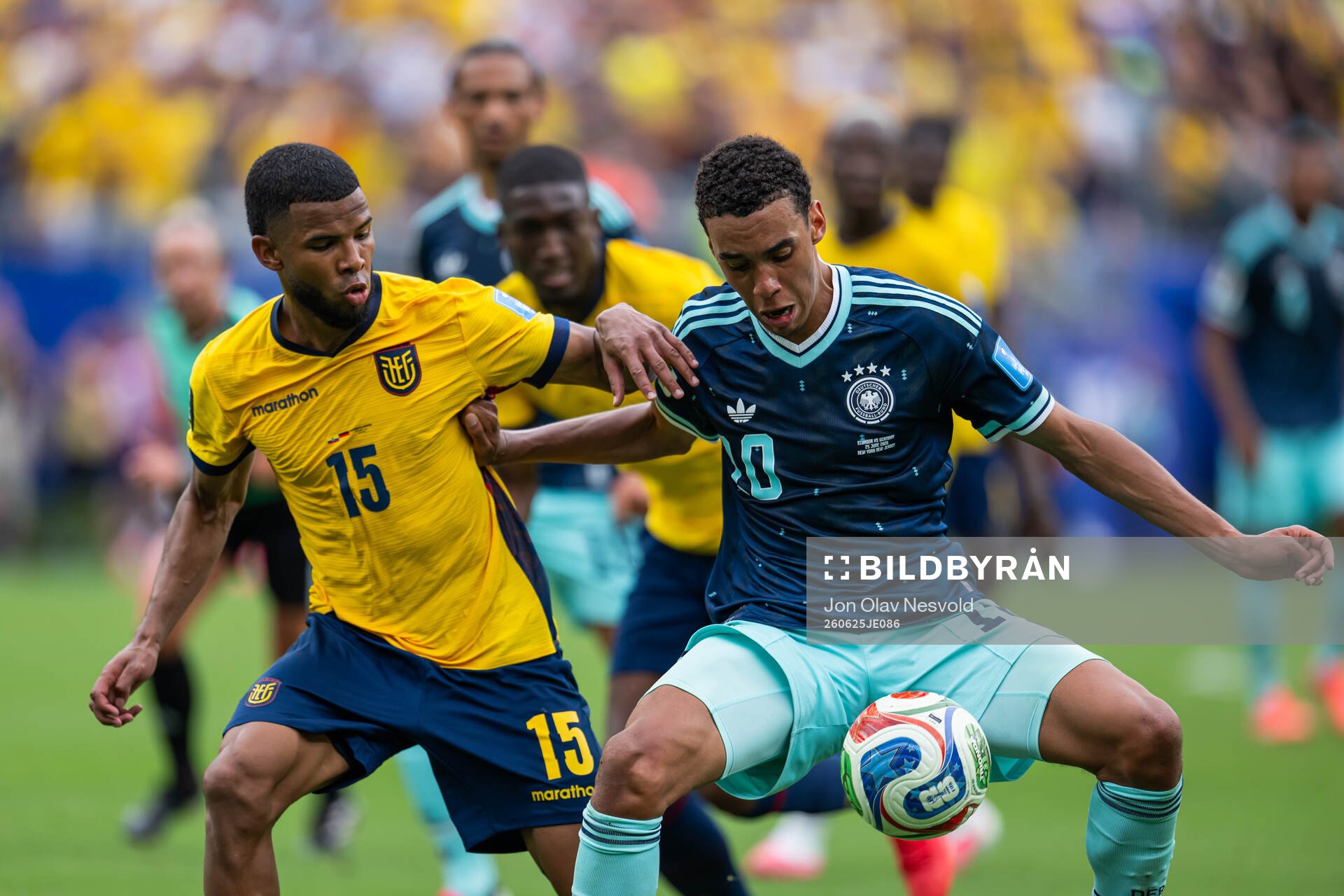 Pedro Vite of Ecuador and Jamal Musiala of Germany