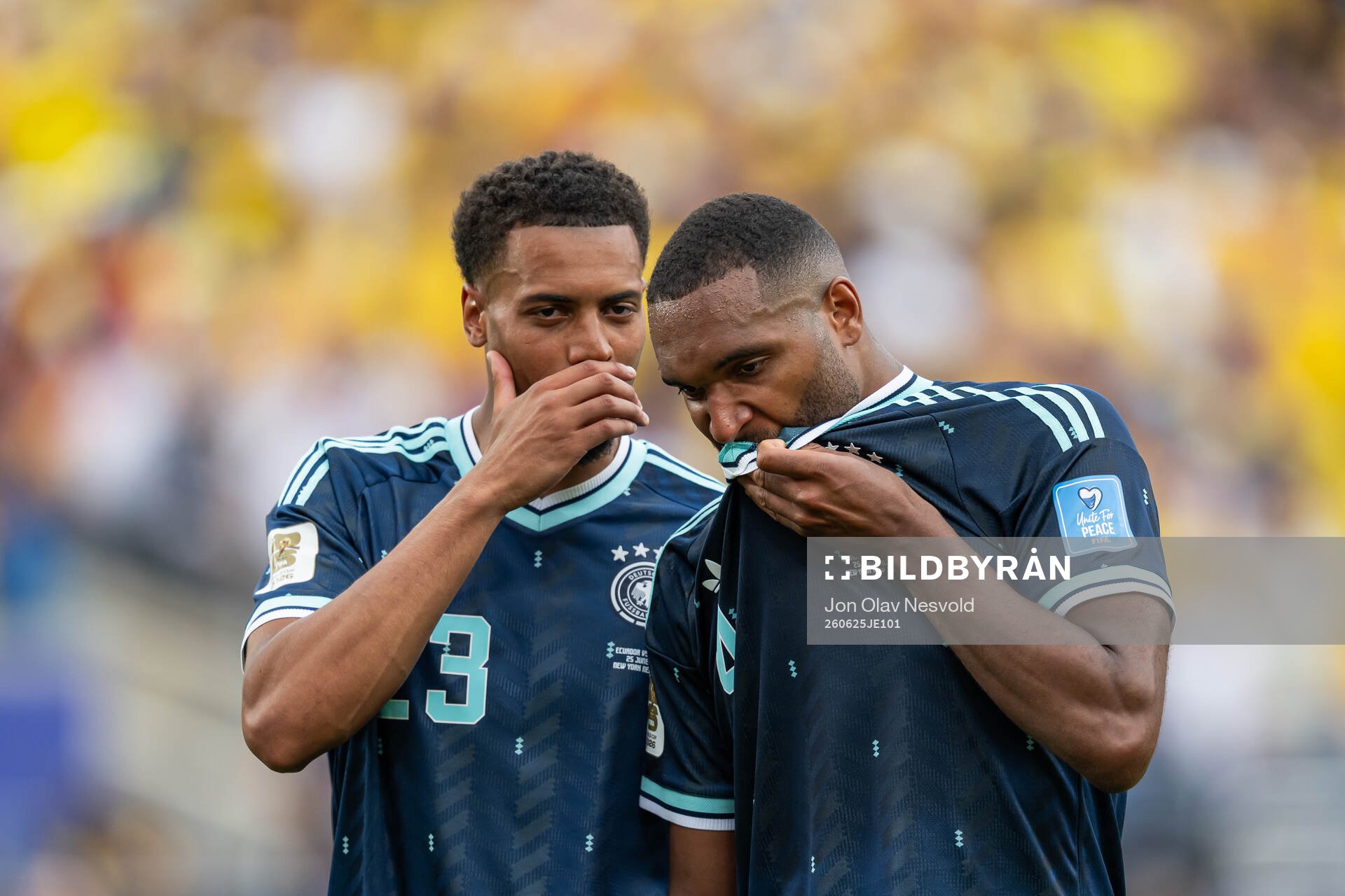 Felix Nmecha and Jonathan Tah of Germany look dejected