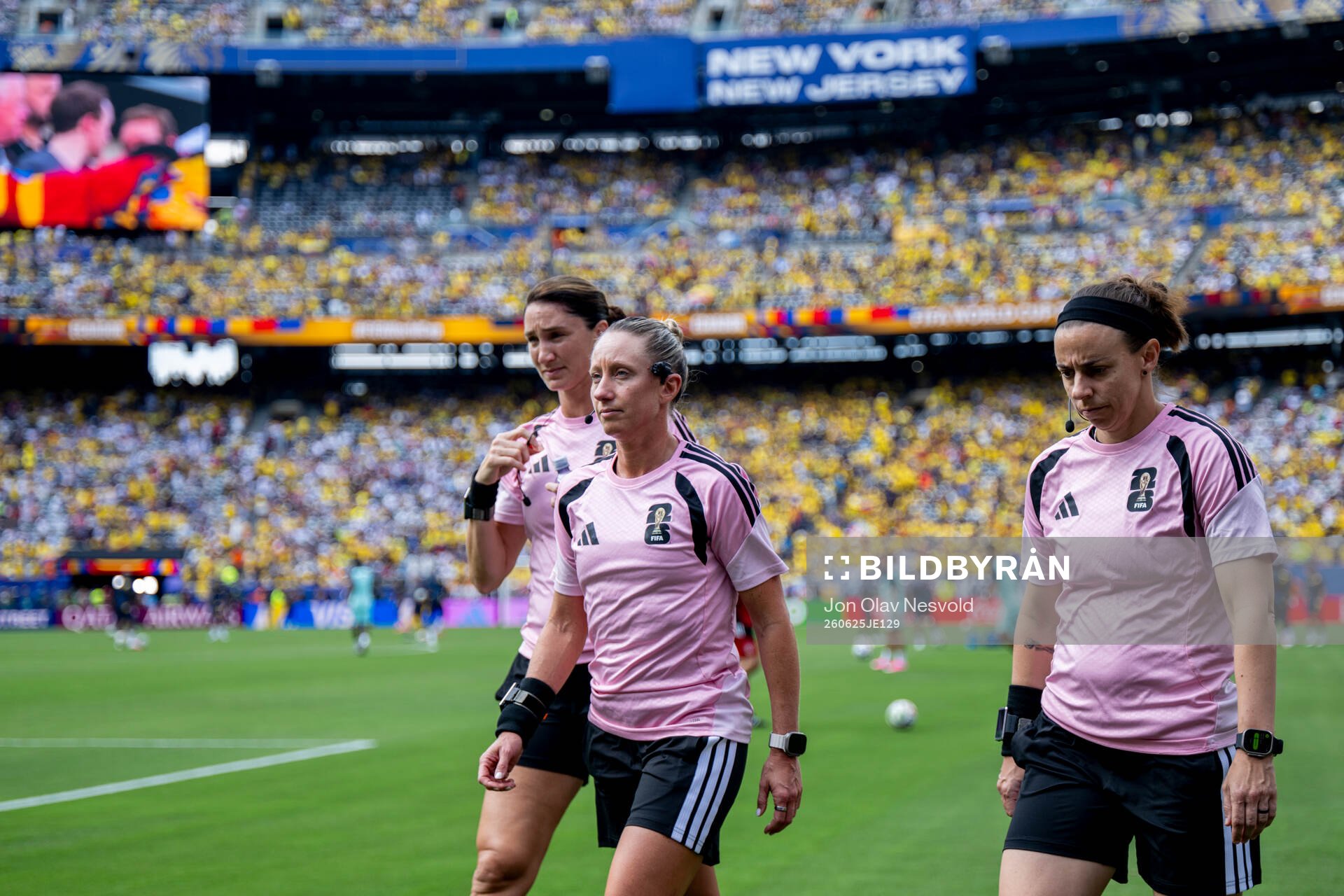 Kathryn Nesbitt, assistant referee, Tori Penso, referee and