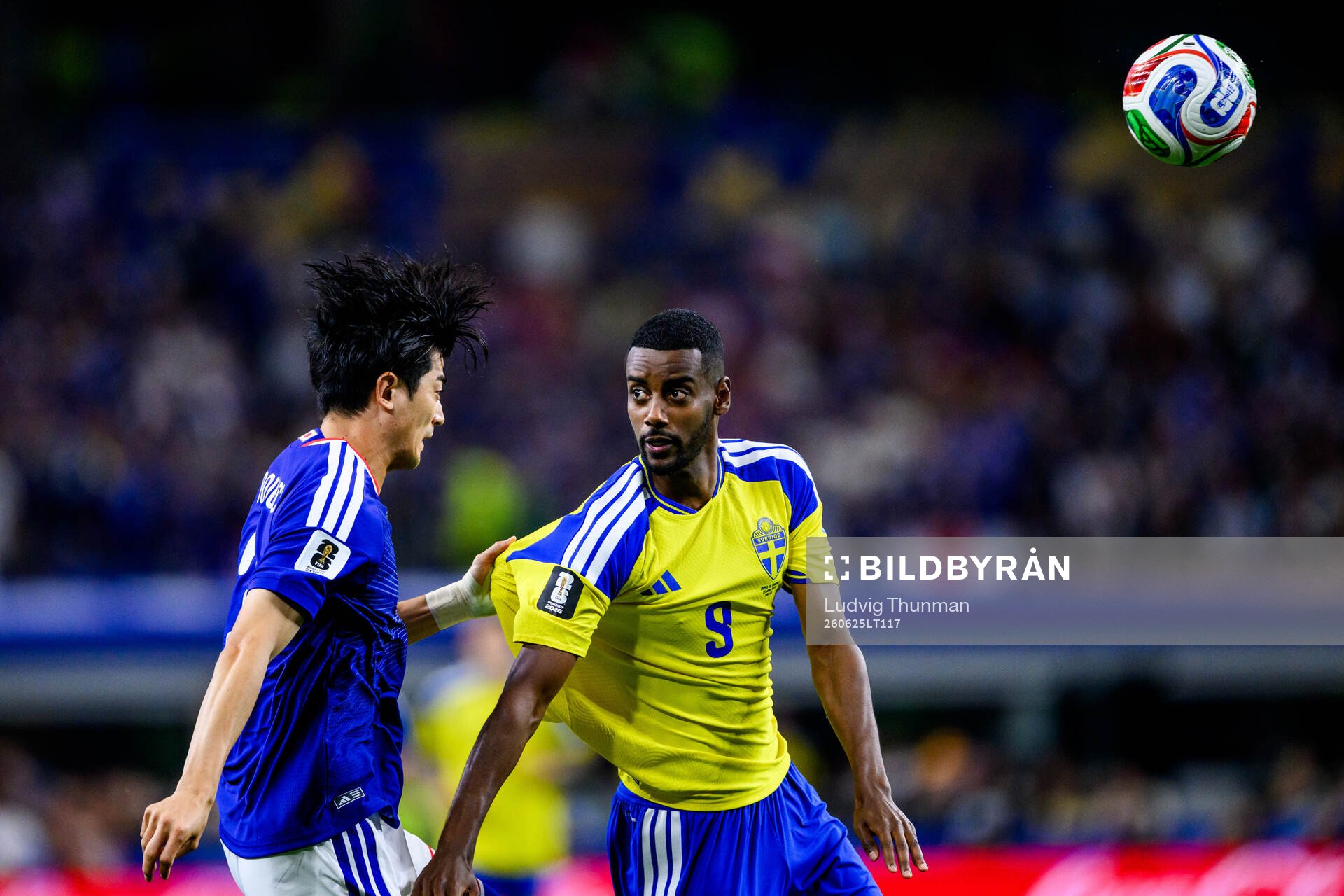 Shogo Taniguchi of Japan and Alexander Isak of Sweden