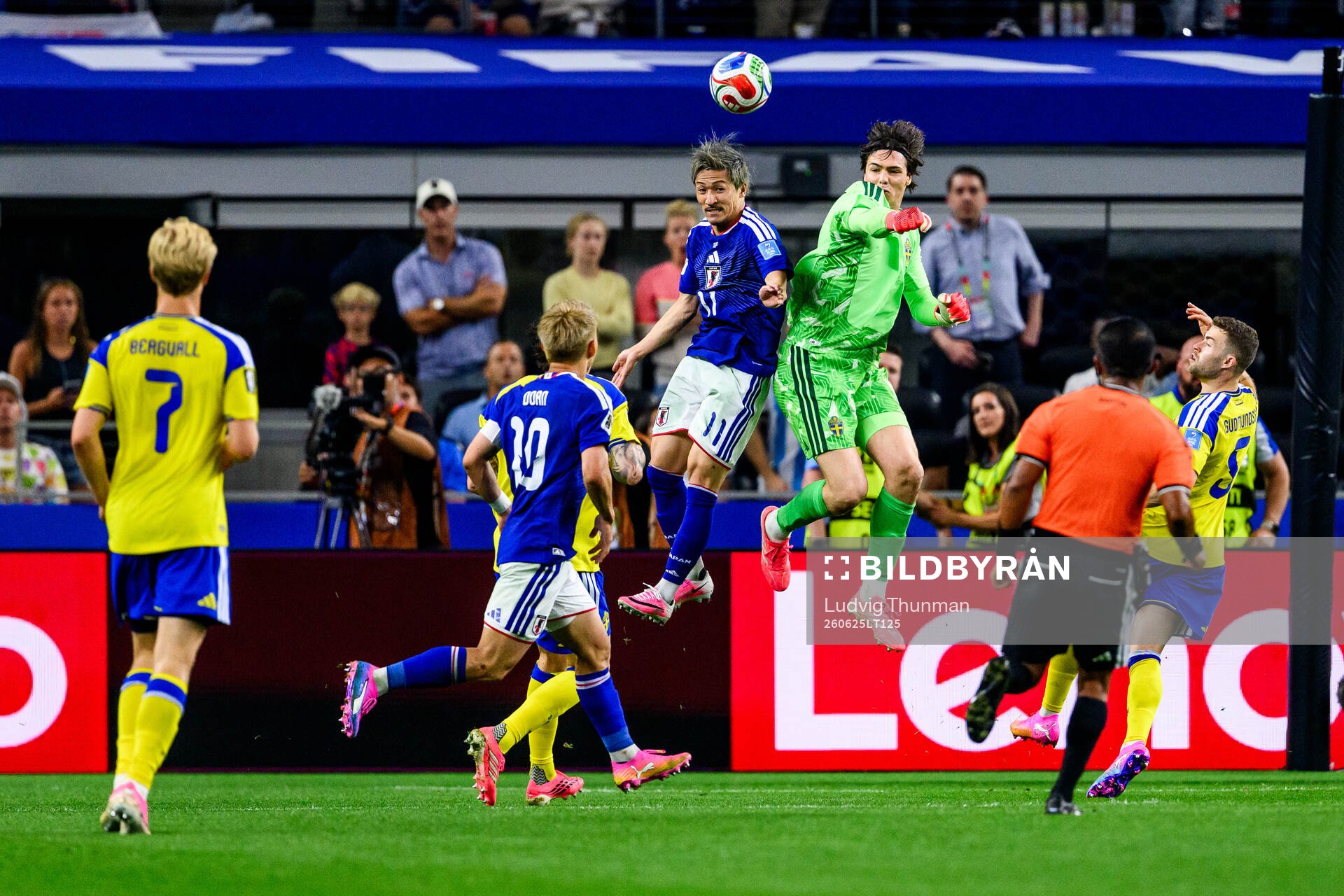 Daizen Maeda of Japan and goalkeeper Jacob Widell