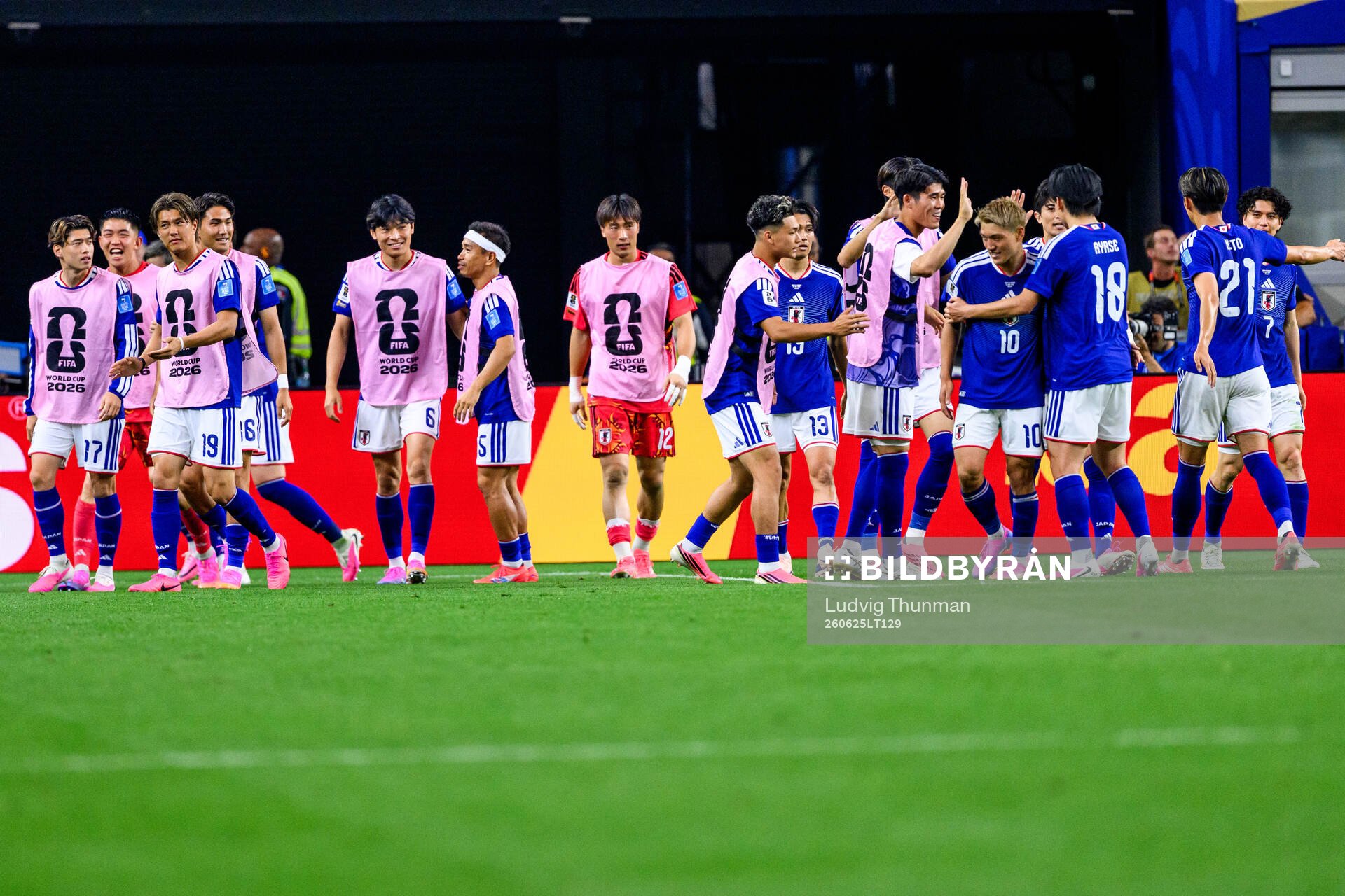 Players of Japan celebrate 1-0