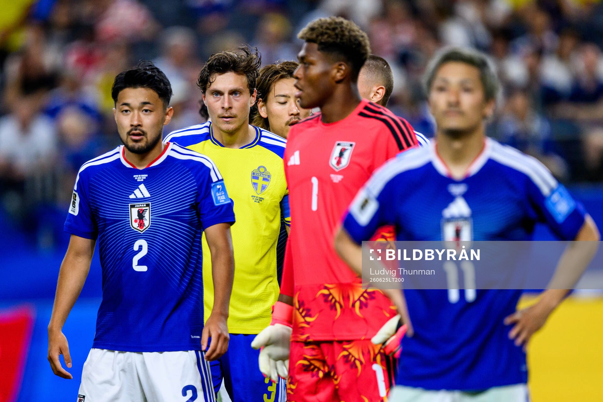Yukinari Sugawara and goalkeeper Zion Suzuki of Japan and