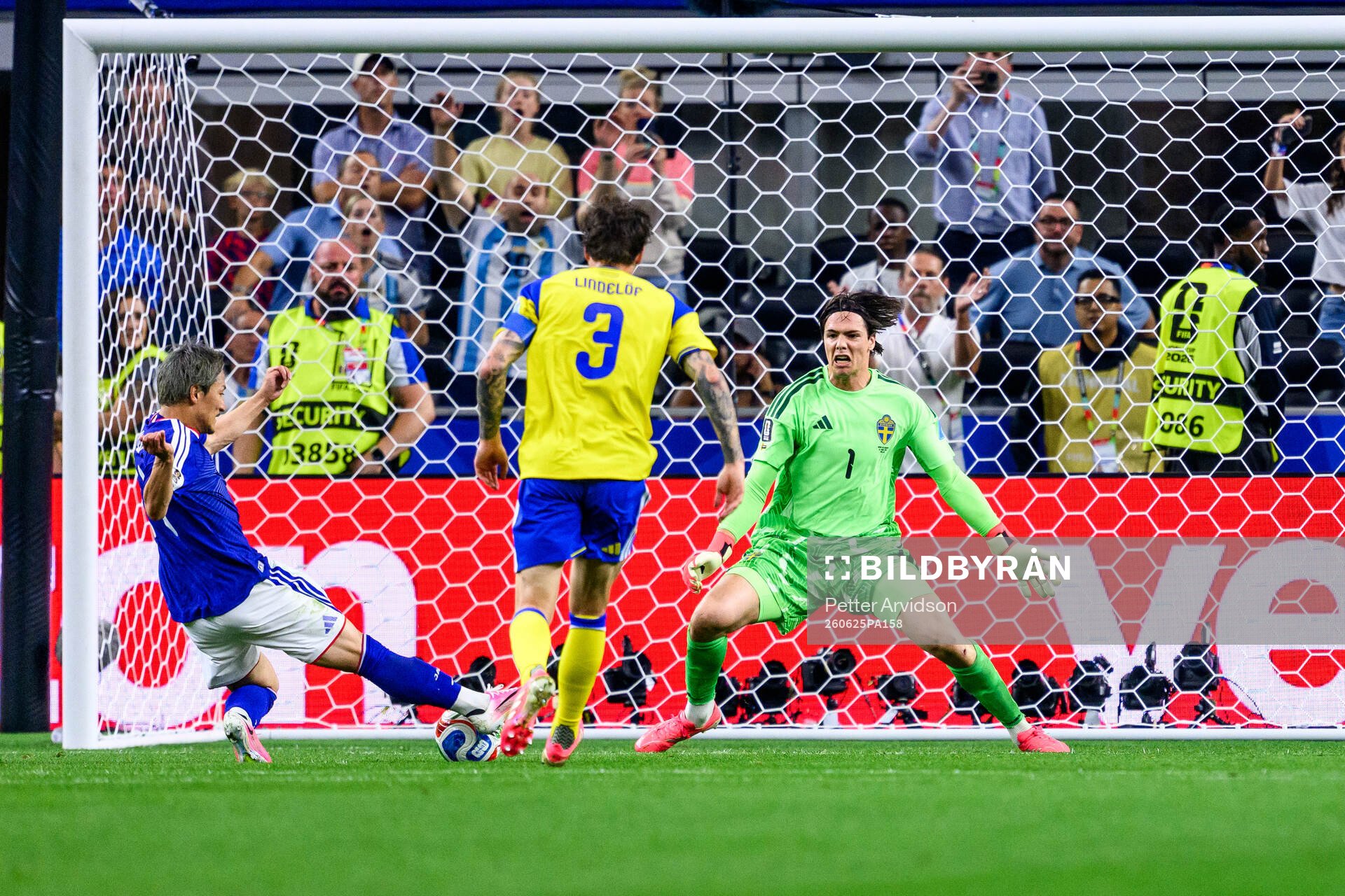 Daizen Maeda of Japan and goalkeeper Jacob Widell