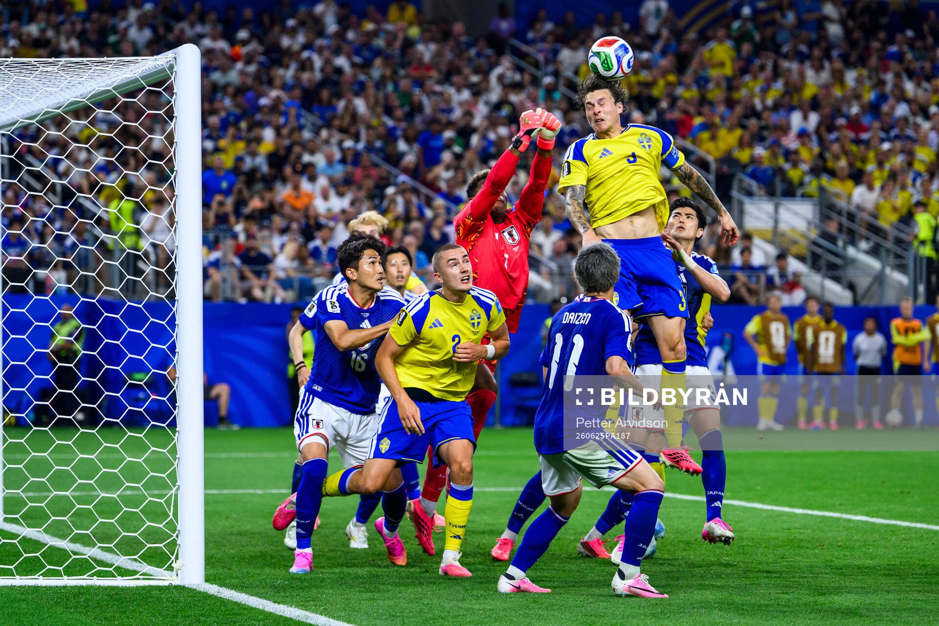 Goalkeeper Zion Suzuki of Japan and Gustaf Lagerbielke and
