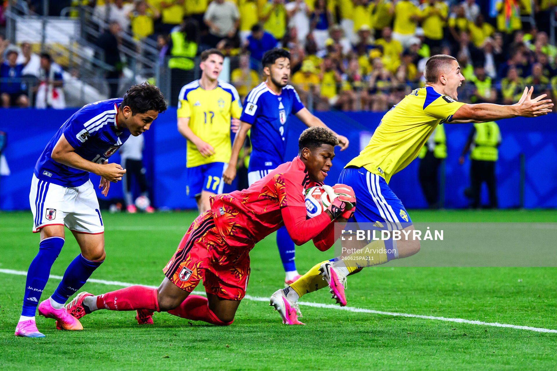 Goalkeeper Zion Suzuki of Japan and Gustaf Lagerbielke of