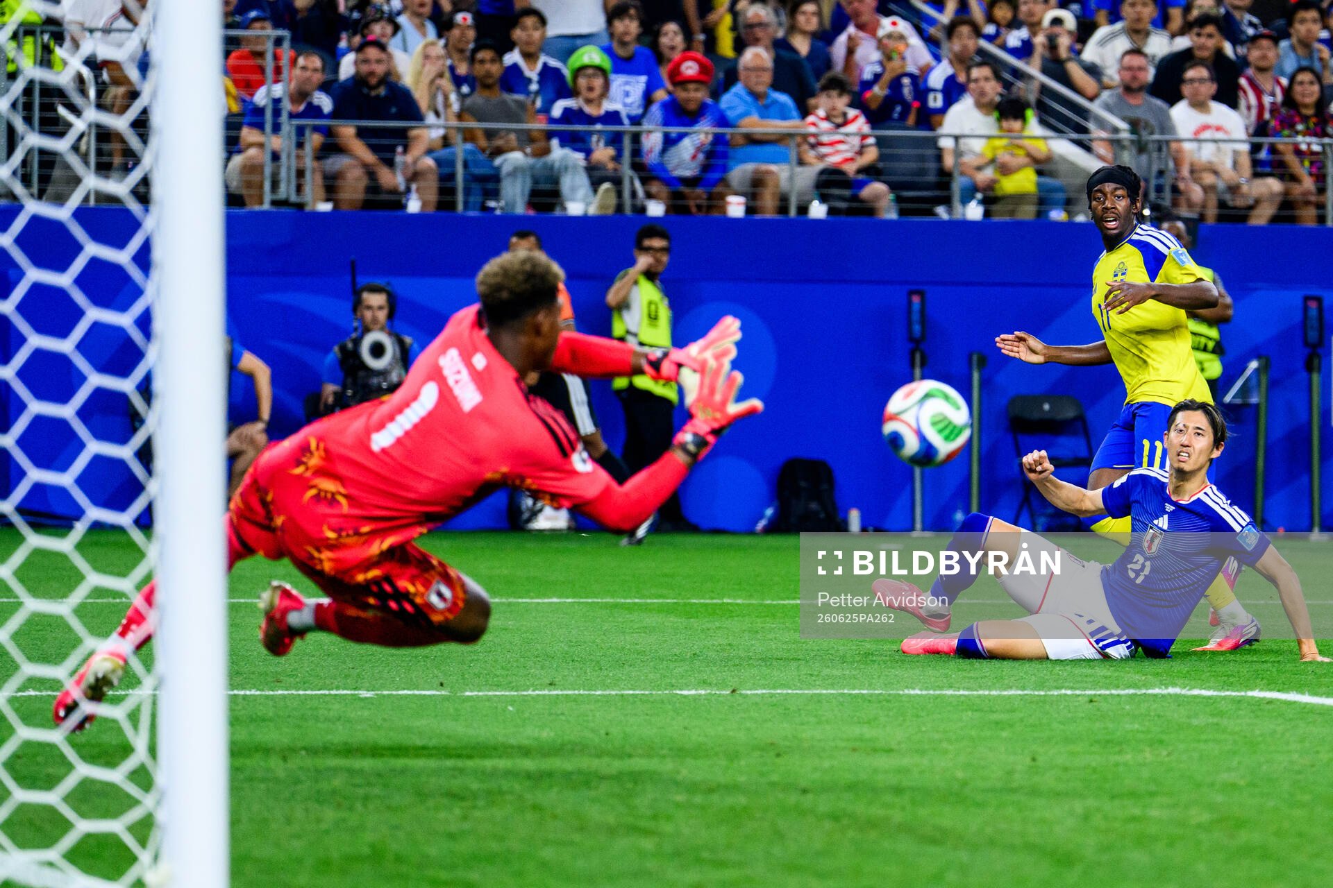 Anthony Elanga of Sweden and goalkeeper Zion Suzuki and