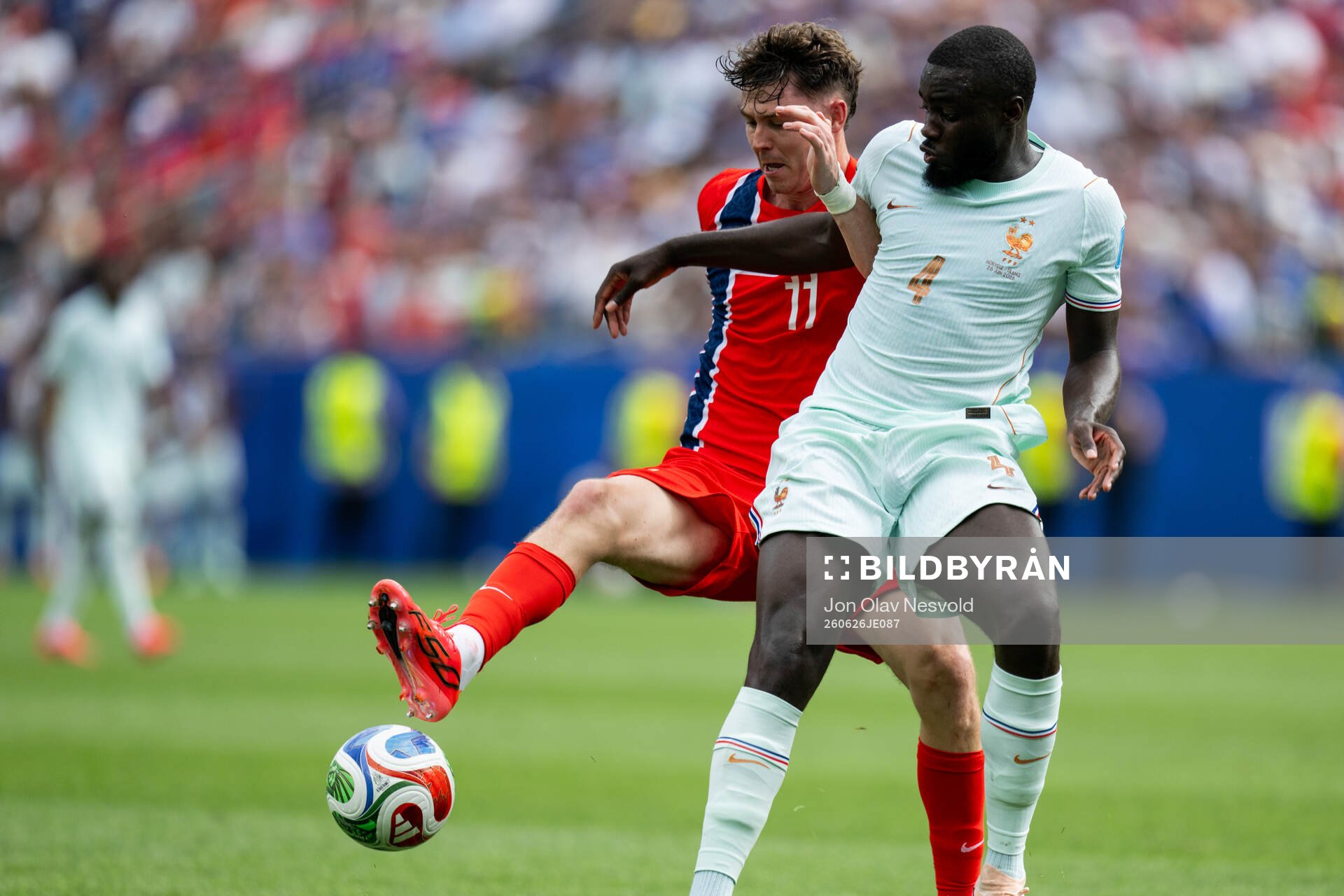 Jørgen Strand Larsen of Norway and Dayot Upamecano of