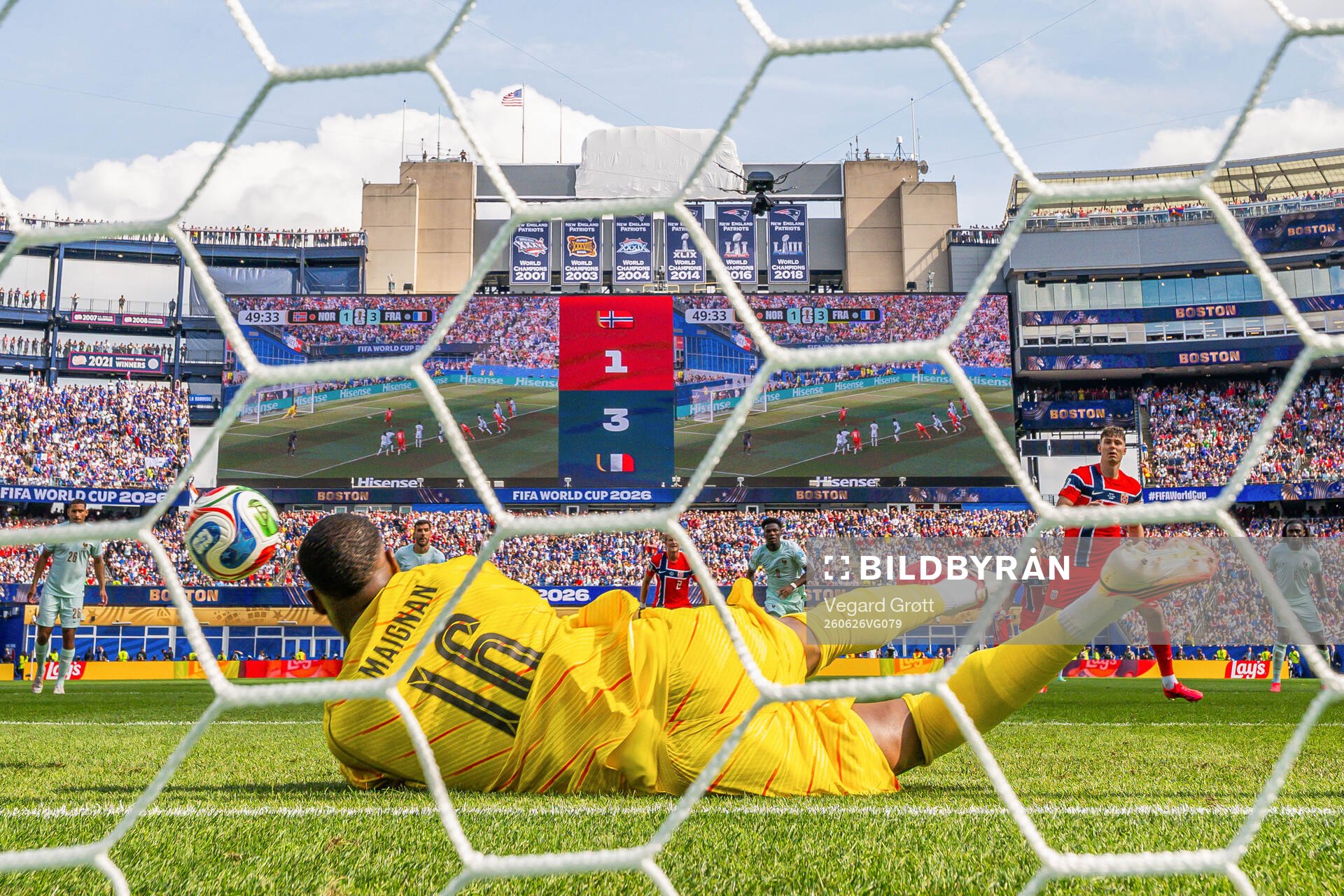 Goalkeeper Mike Maignan of France saves the penalty kick