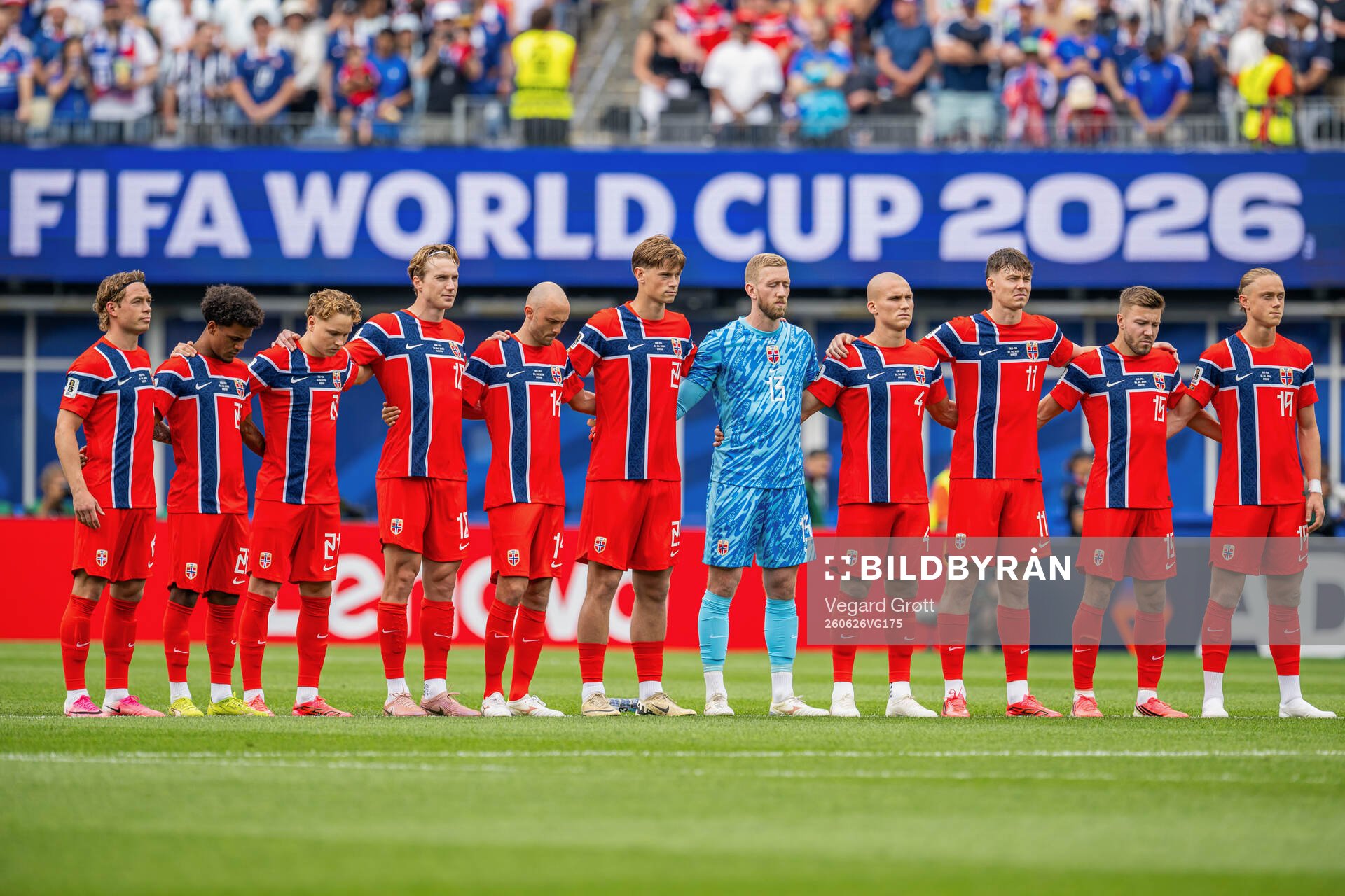 Players of Norway line up for a minute of silence