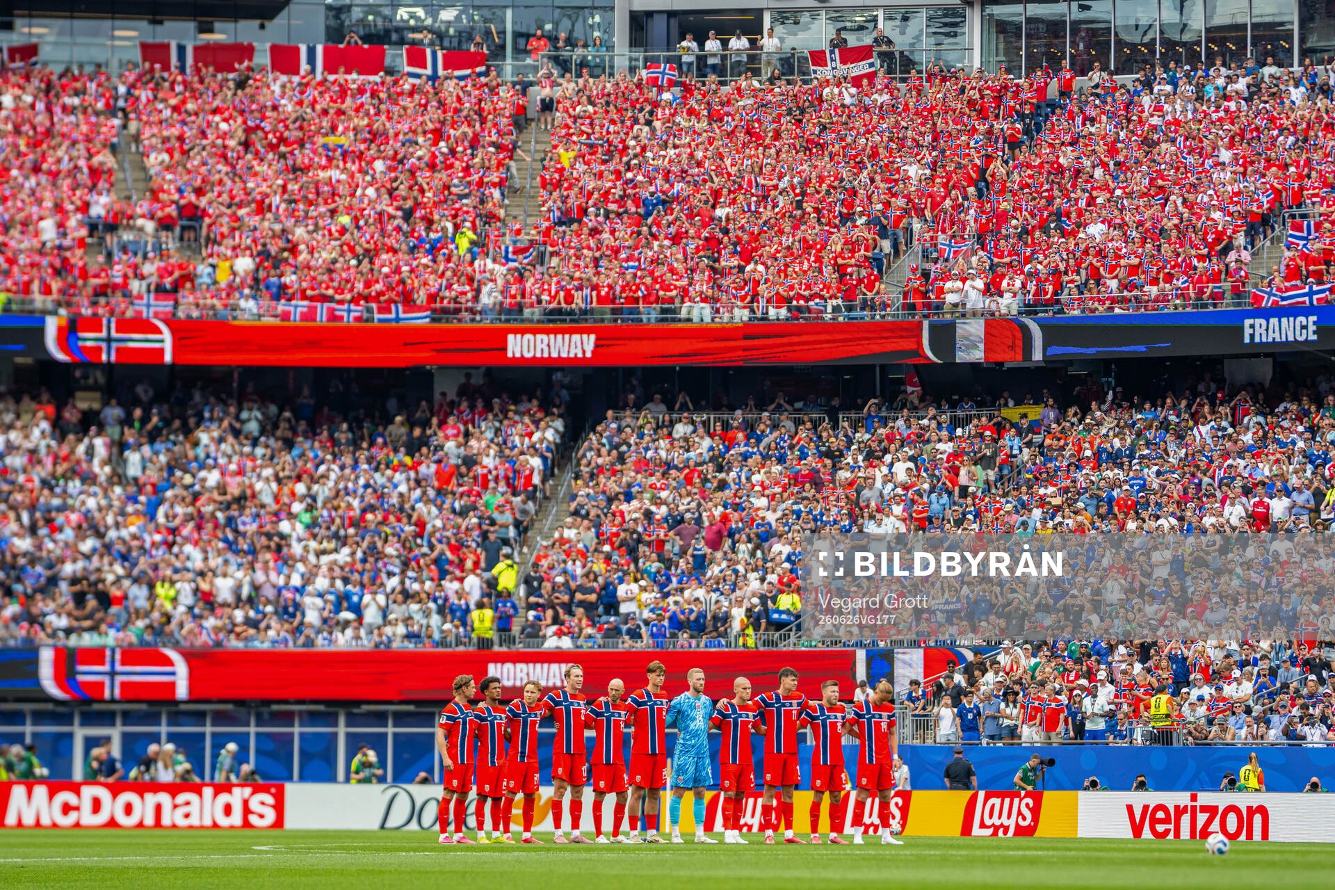 Players of Norway line up for a minute of silence
