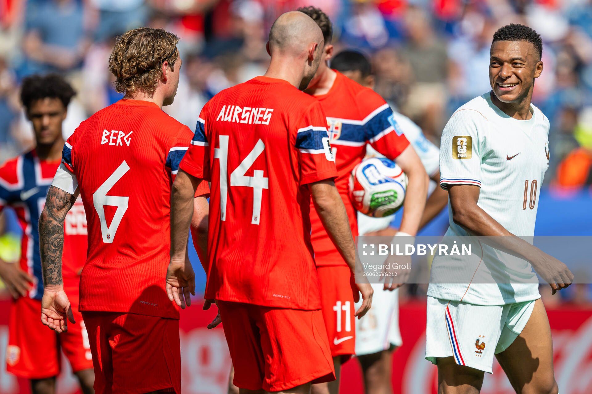 Patrick Berg of Norway and Kylian Mbappe of France