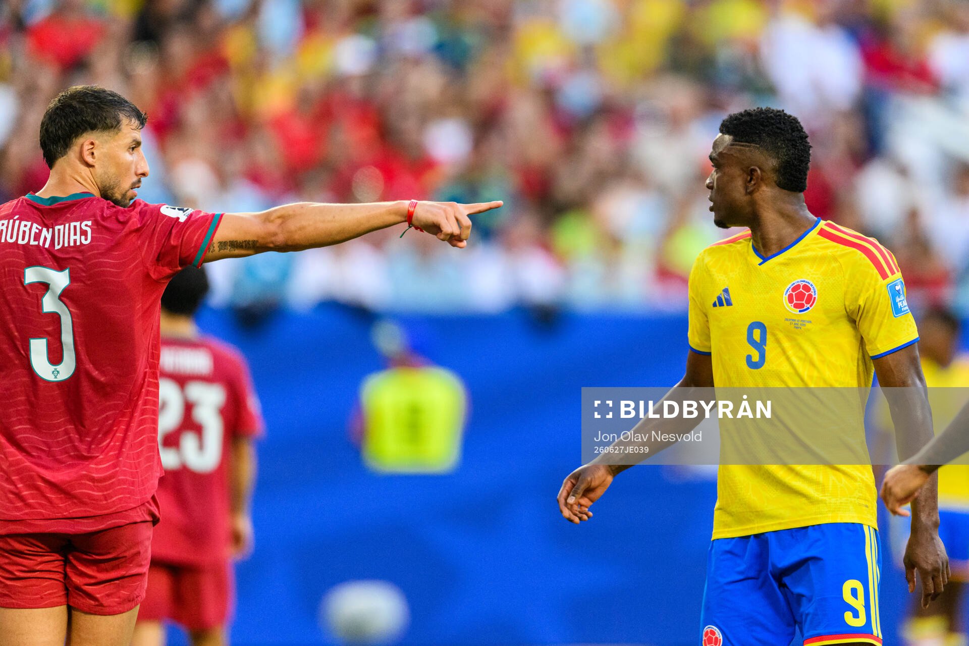Ruben Dias of Portugal and Jhon Cordoba of Colombia