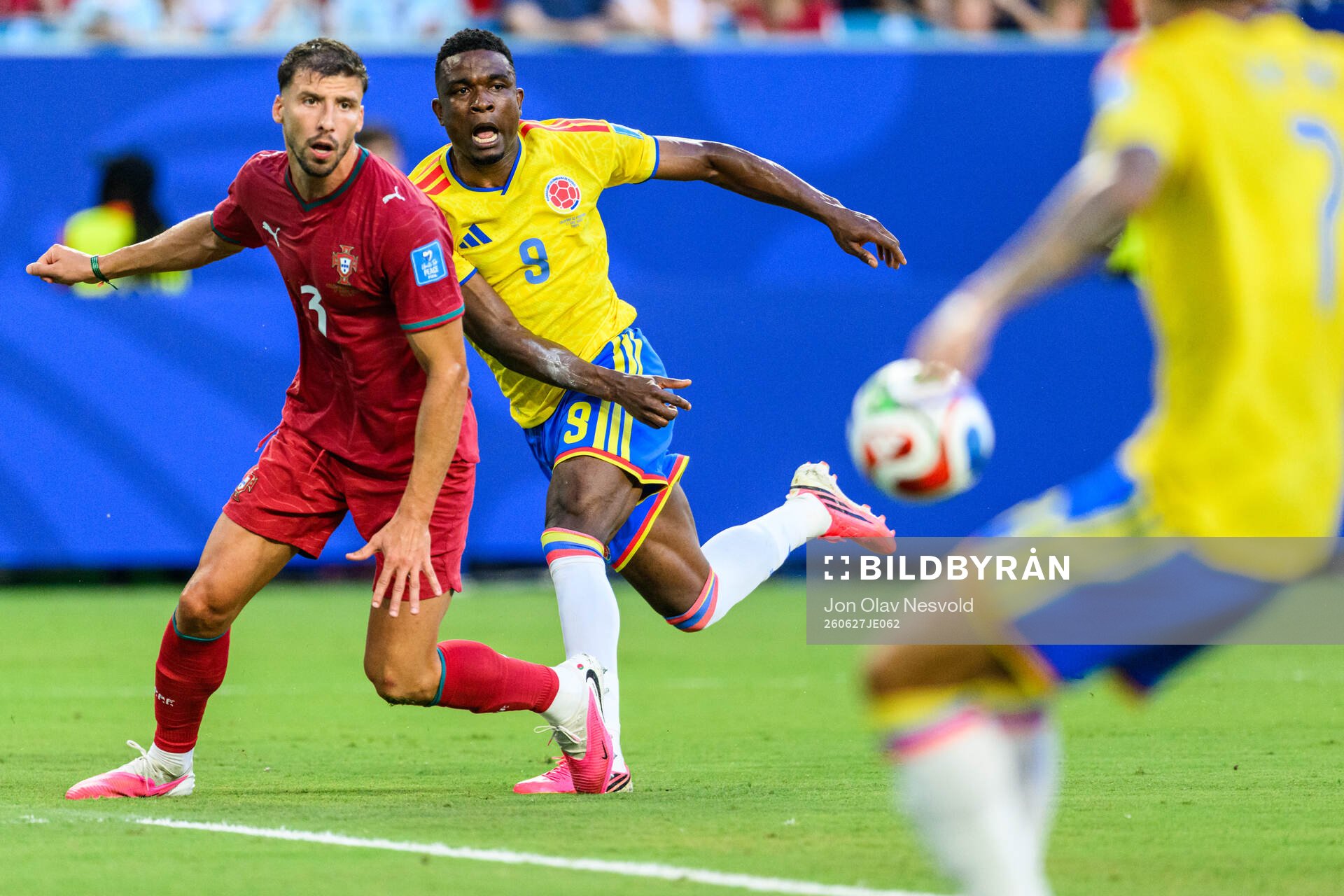 Ruben Dias of Portugal and Jhon Cordoba of Colombia