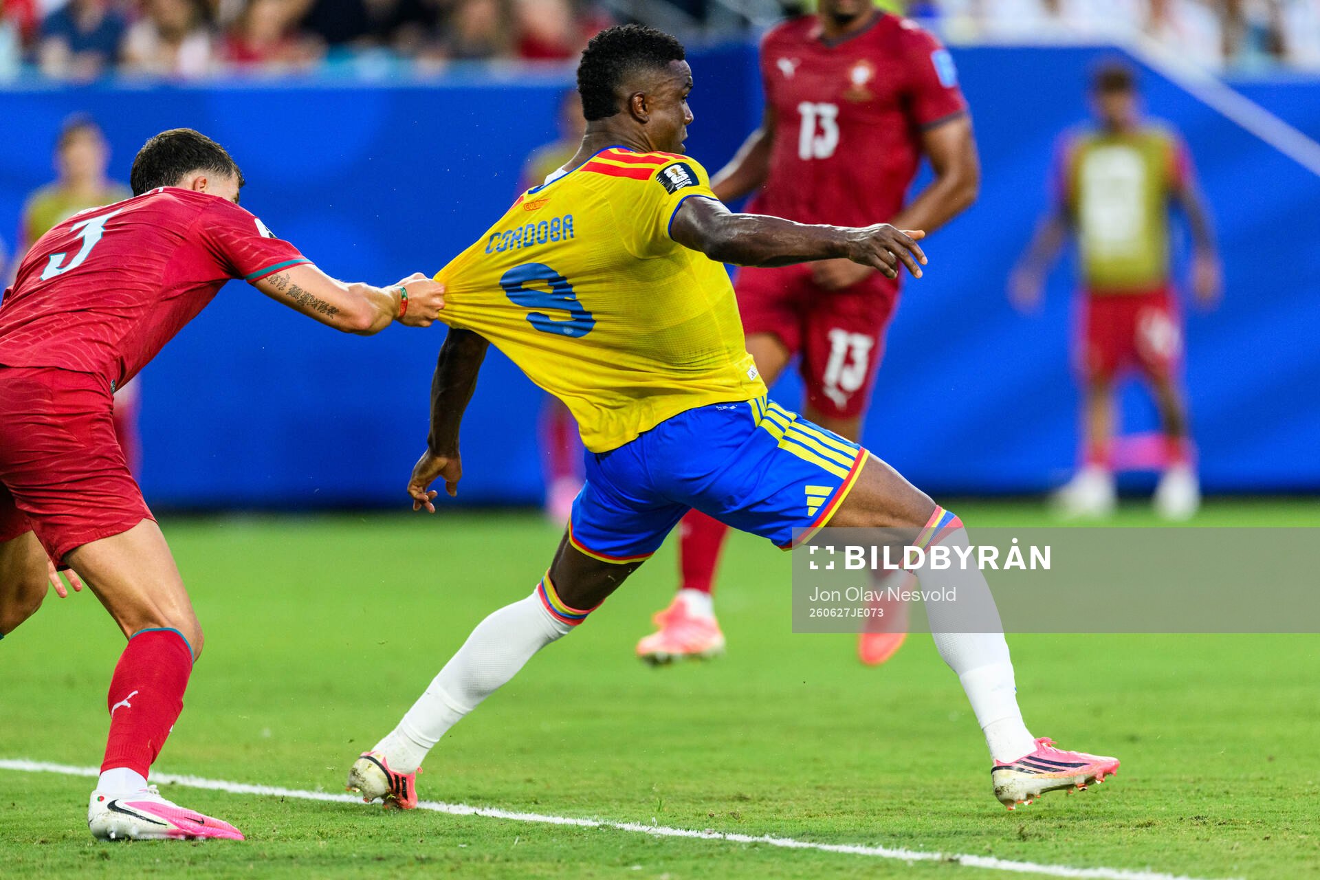 Ruben Dias of Portugal and Jhon Cordoba of Colombia