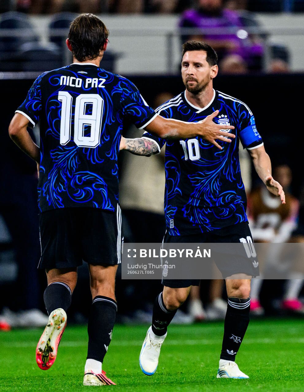 Nico Paz and Lionel Messi of Argentina