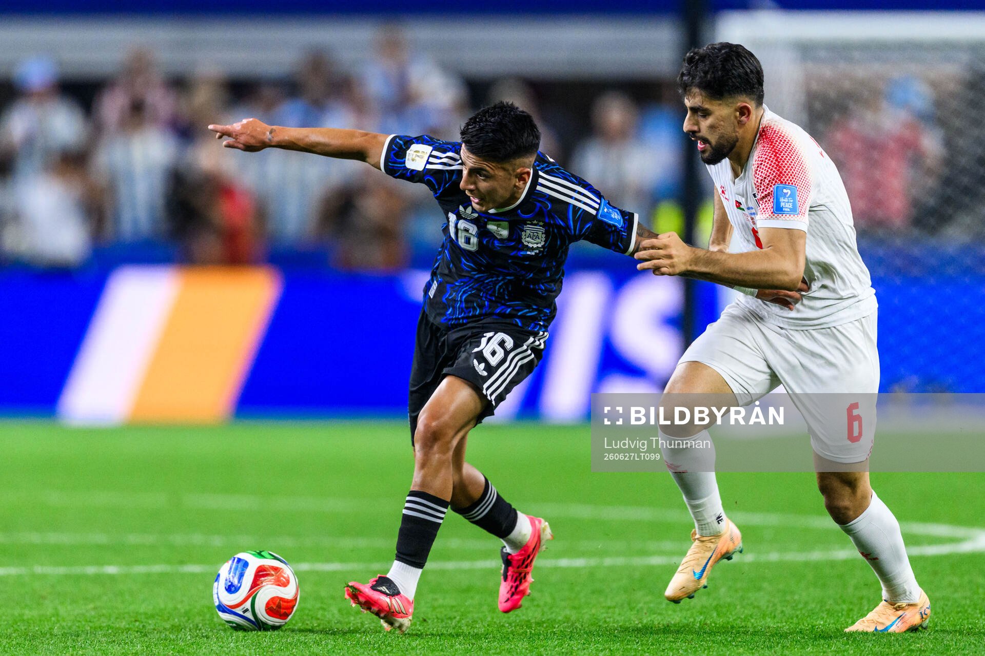 Thiago Almada of Argentina and Amer Jamous of Jordan
