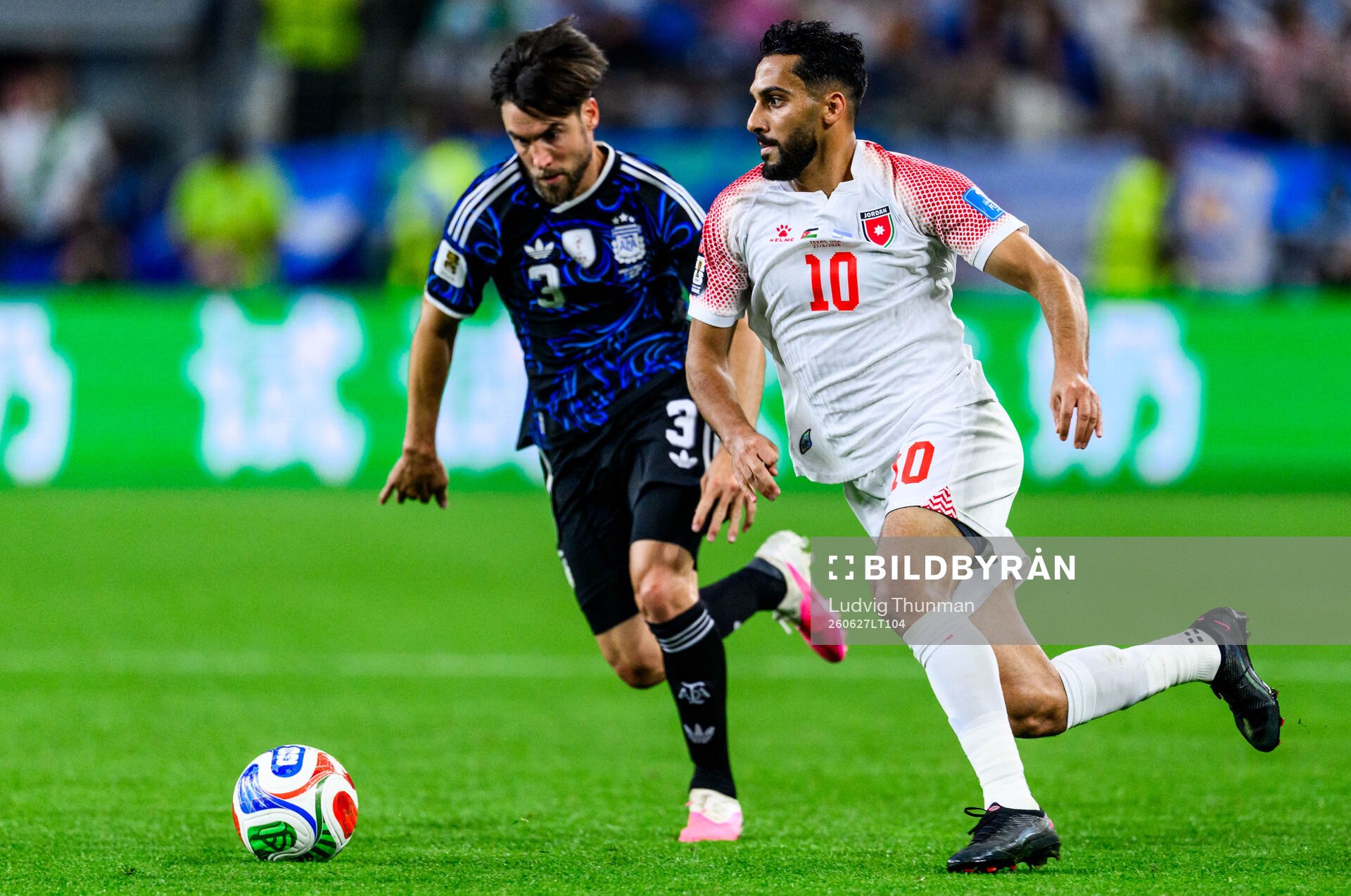 Nicolas Tagliafico of Argentina and Mousa Altamari of Jordan