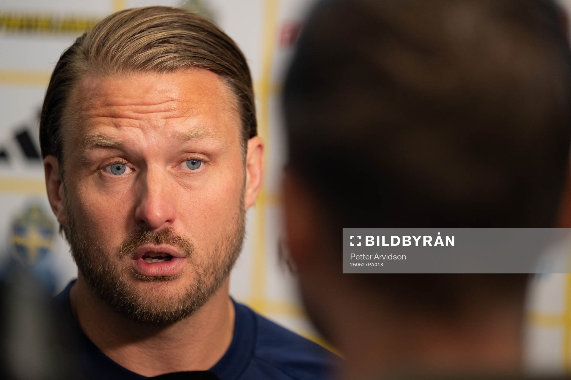 Assistant coach Björn Hamberg at a press event with the
