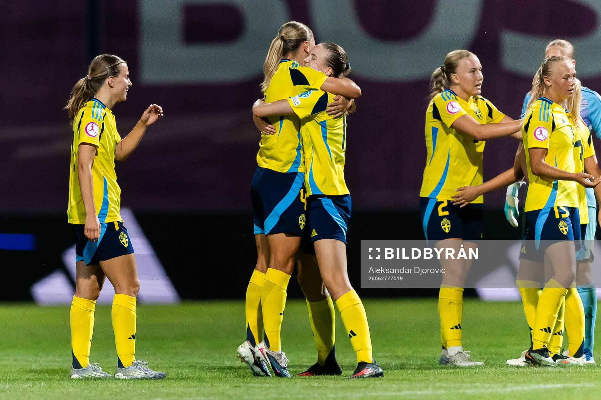 Players of Sweden celebrate by hugging