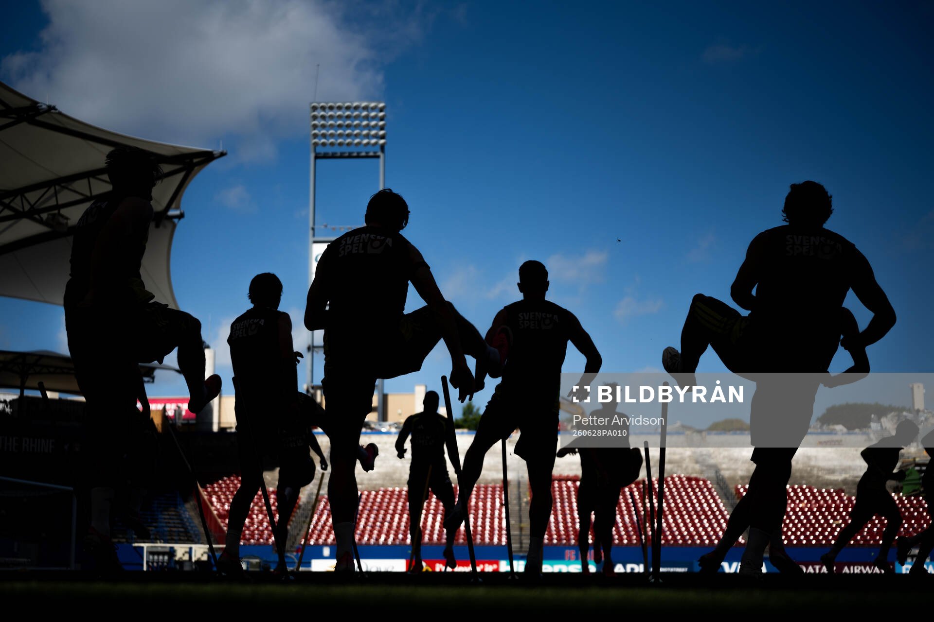 Players of the Swedish national football team in silhouette