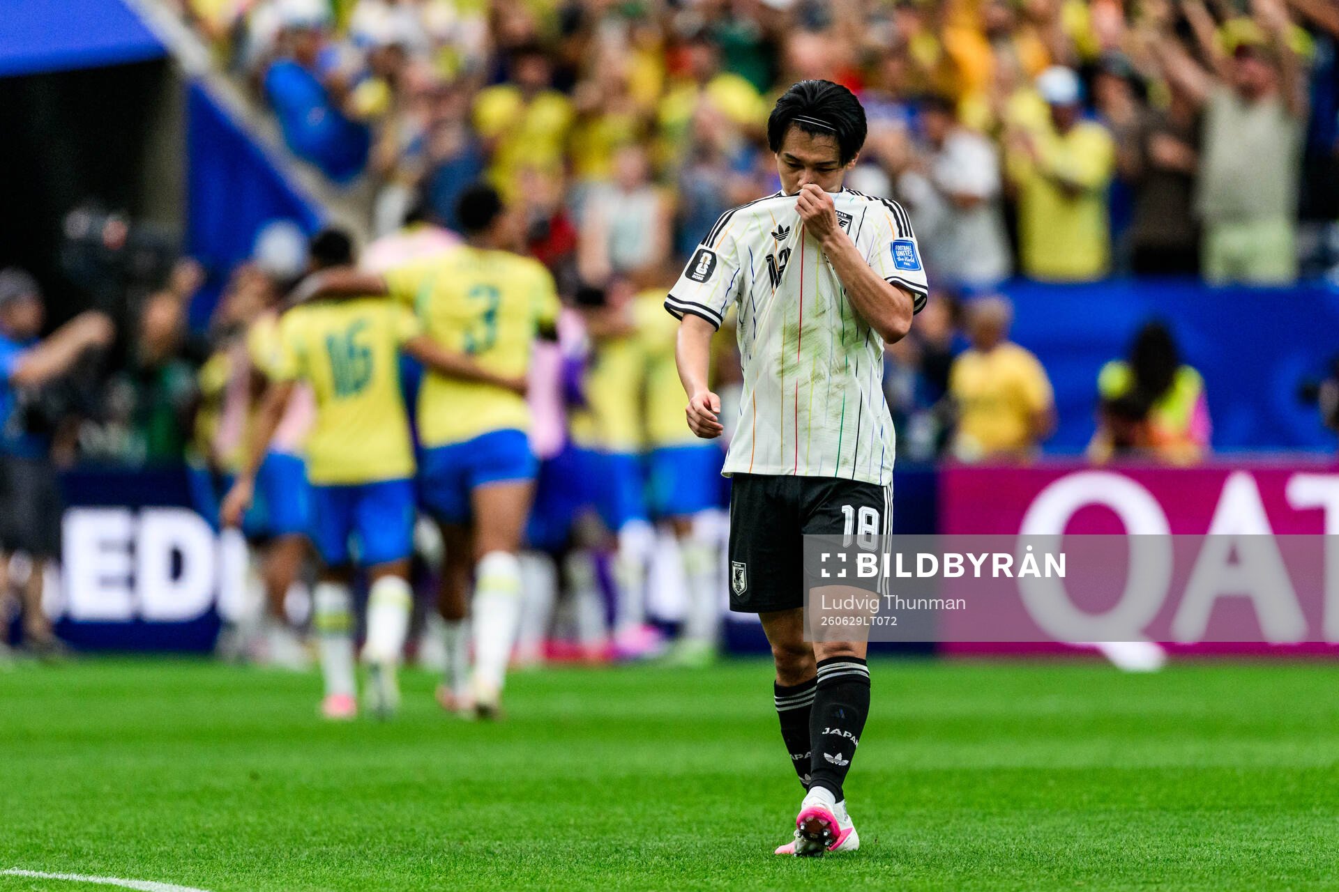 Ayase Ueda of Japan looks dejected